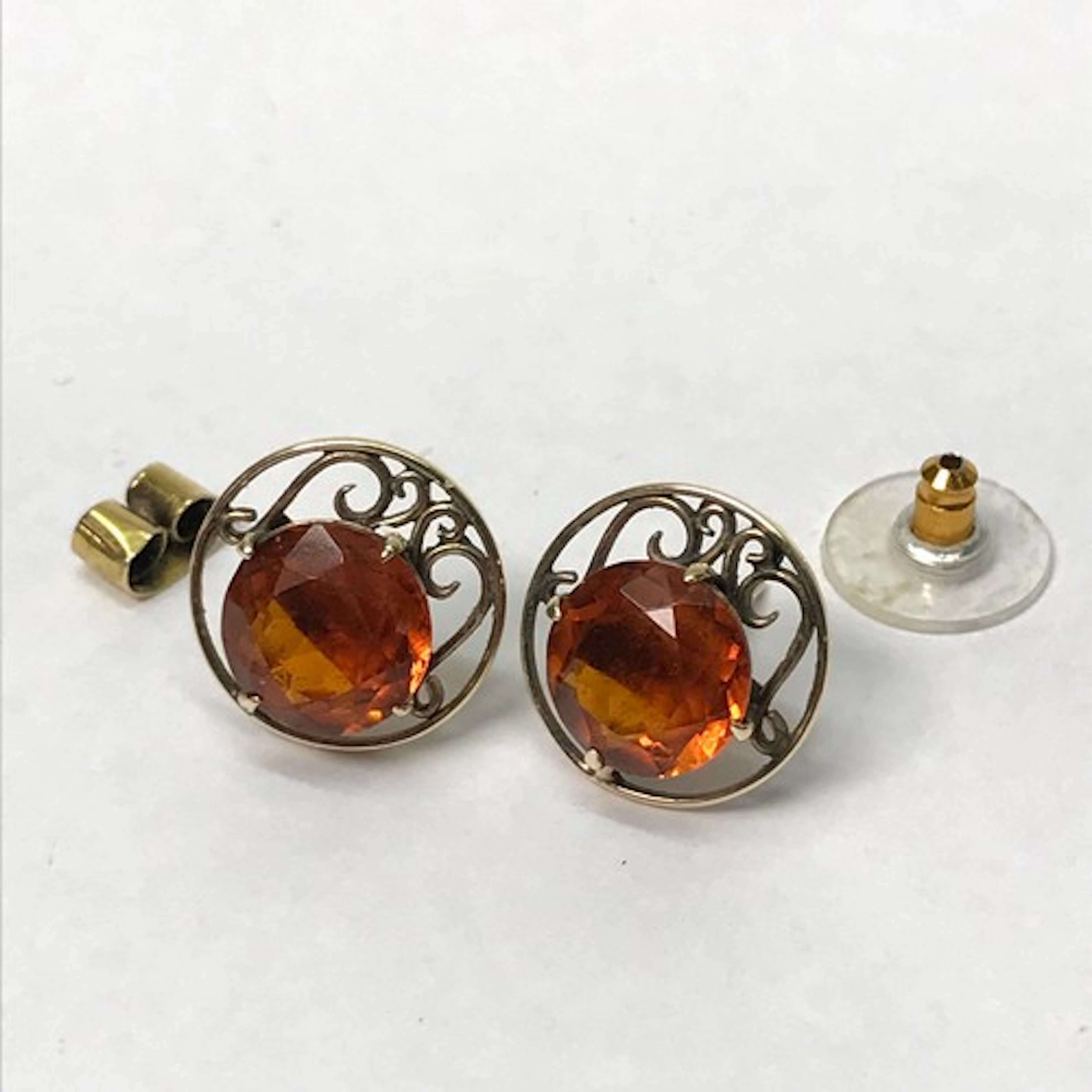 A pair of openwork stud earrings unmarked yellow metal set w...