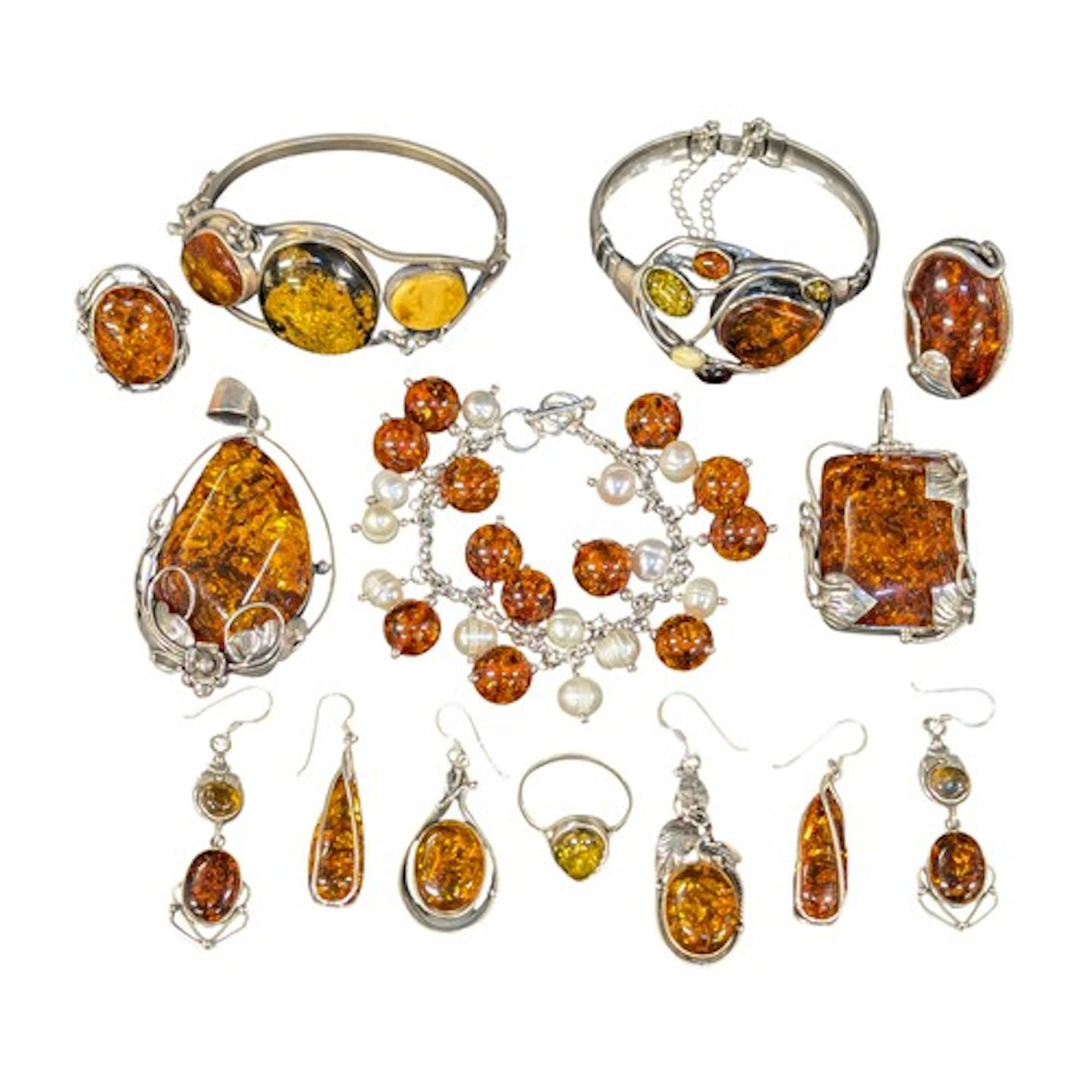 A silver and amber coloured resin six panel cabochon hinge b...