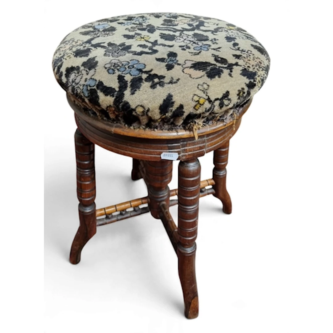 A late 19th century Walnut Show frame Piano Stool with turne...
