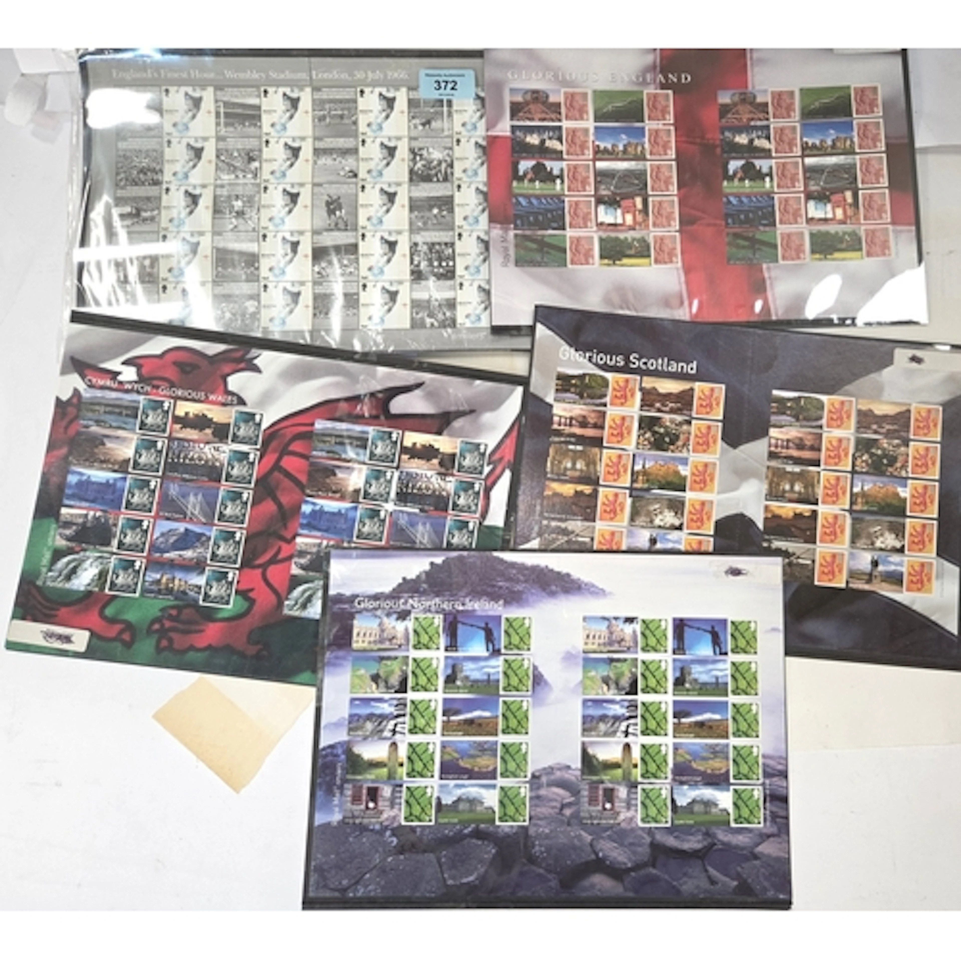 A collection of five pages of 'Smilers' stamps
