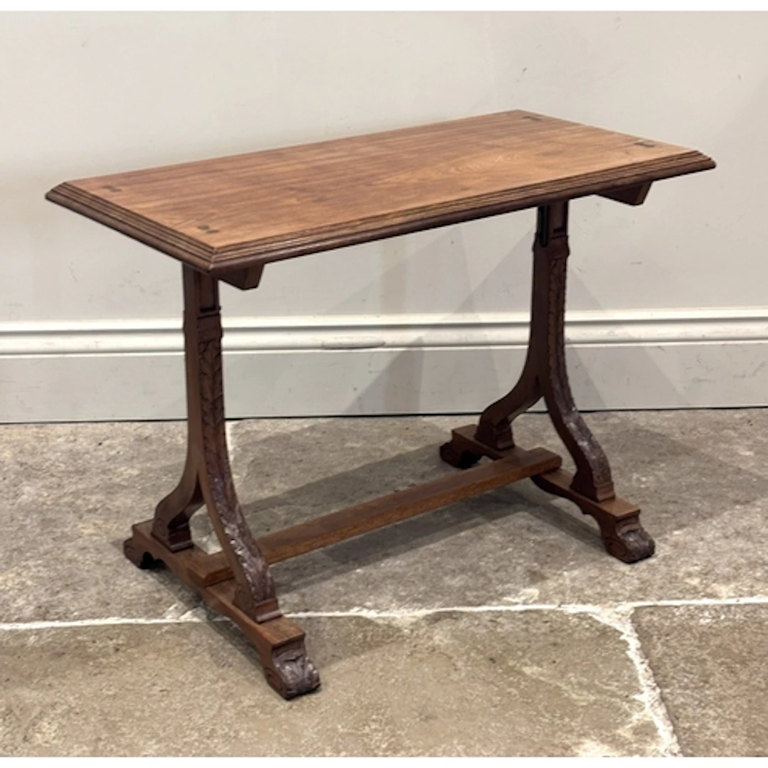 An Edwardian walnut occasional table, the rectangular top ra...