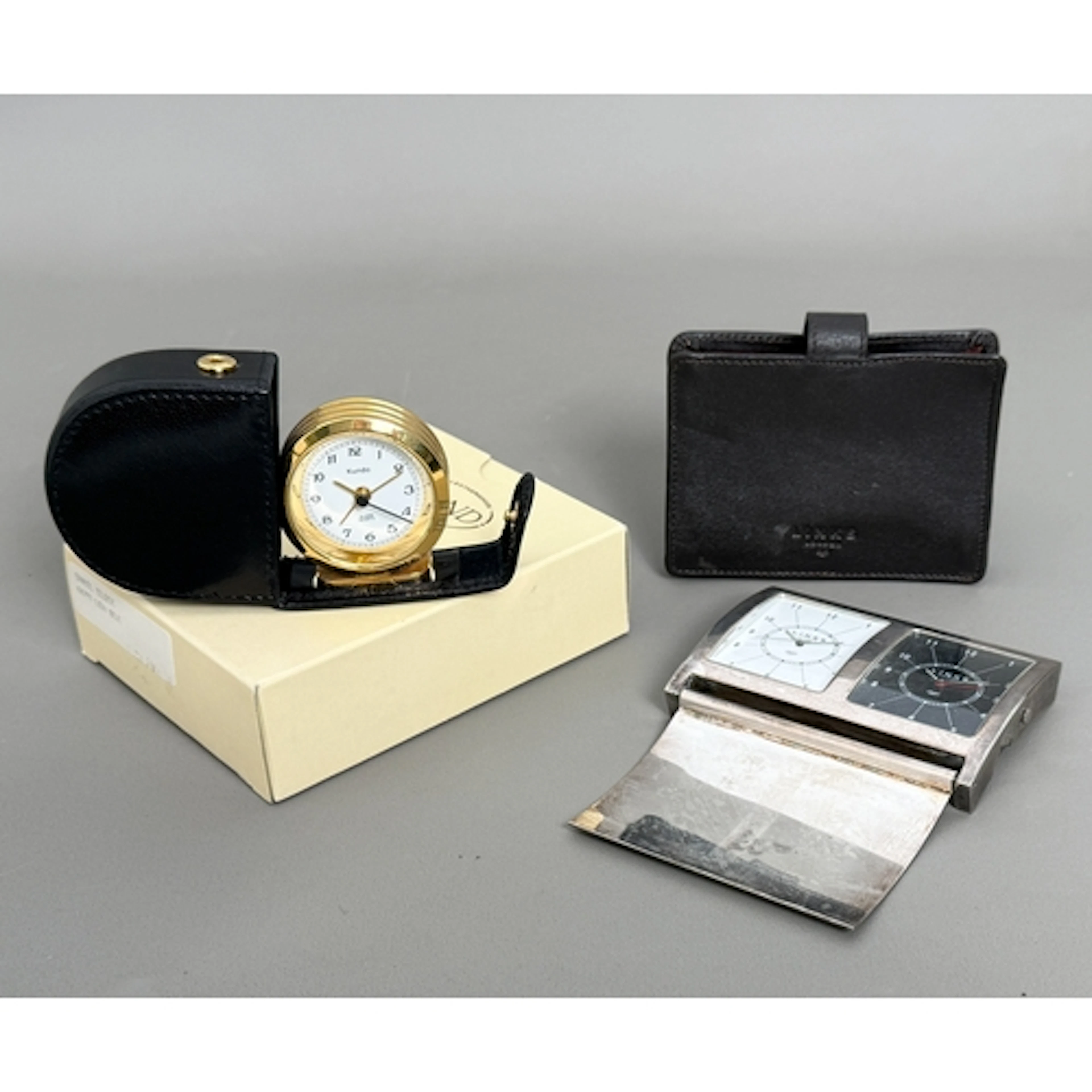 Two travel timepieces - a Links of London dual faced travel ...
