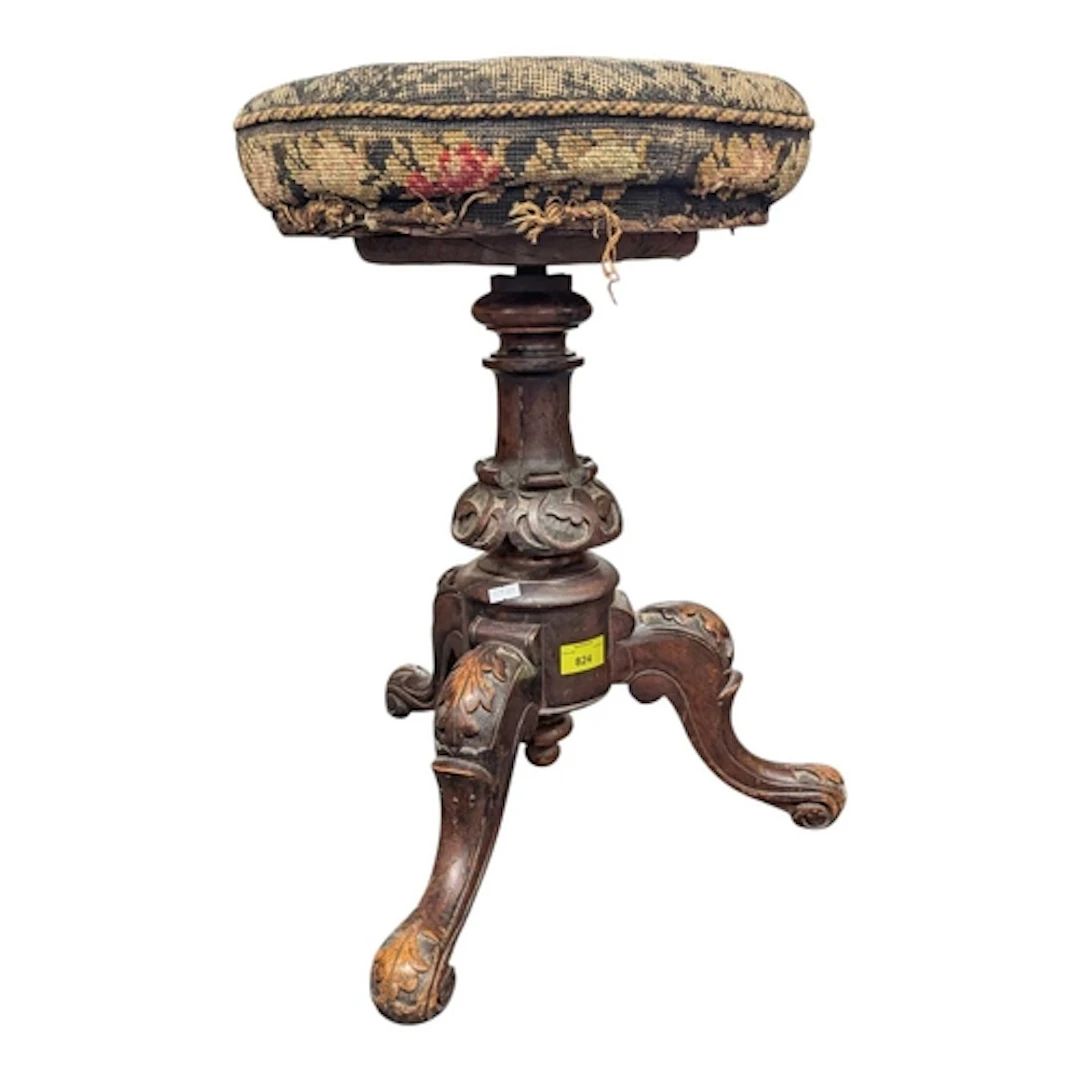 A 19th century Victorian walnut adjustable carved piano stoo...