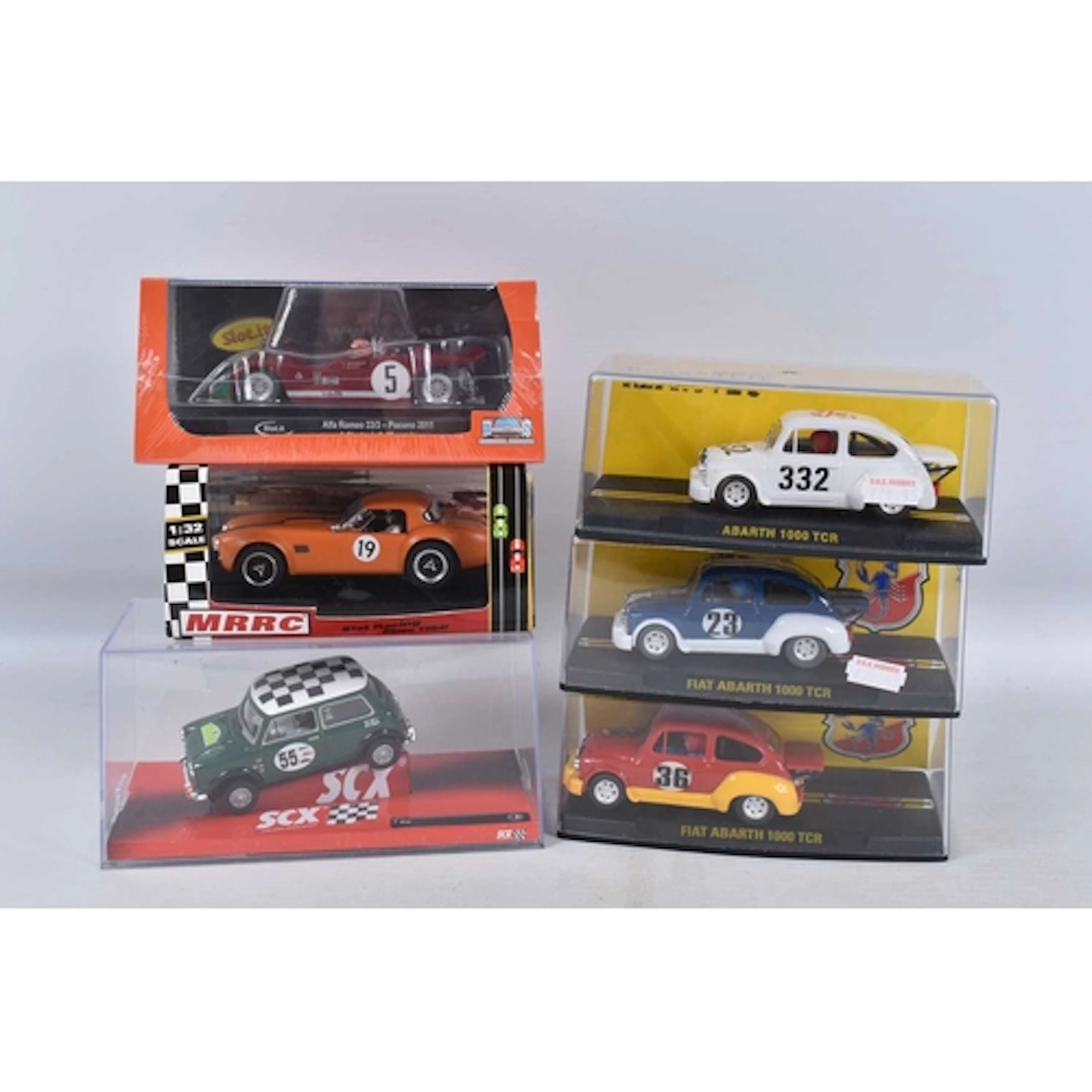 A COLLECTION OF SIX CASED SLOT CARS, to include a Reprotec F...