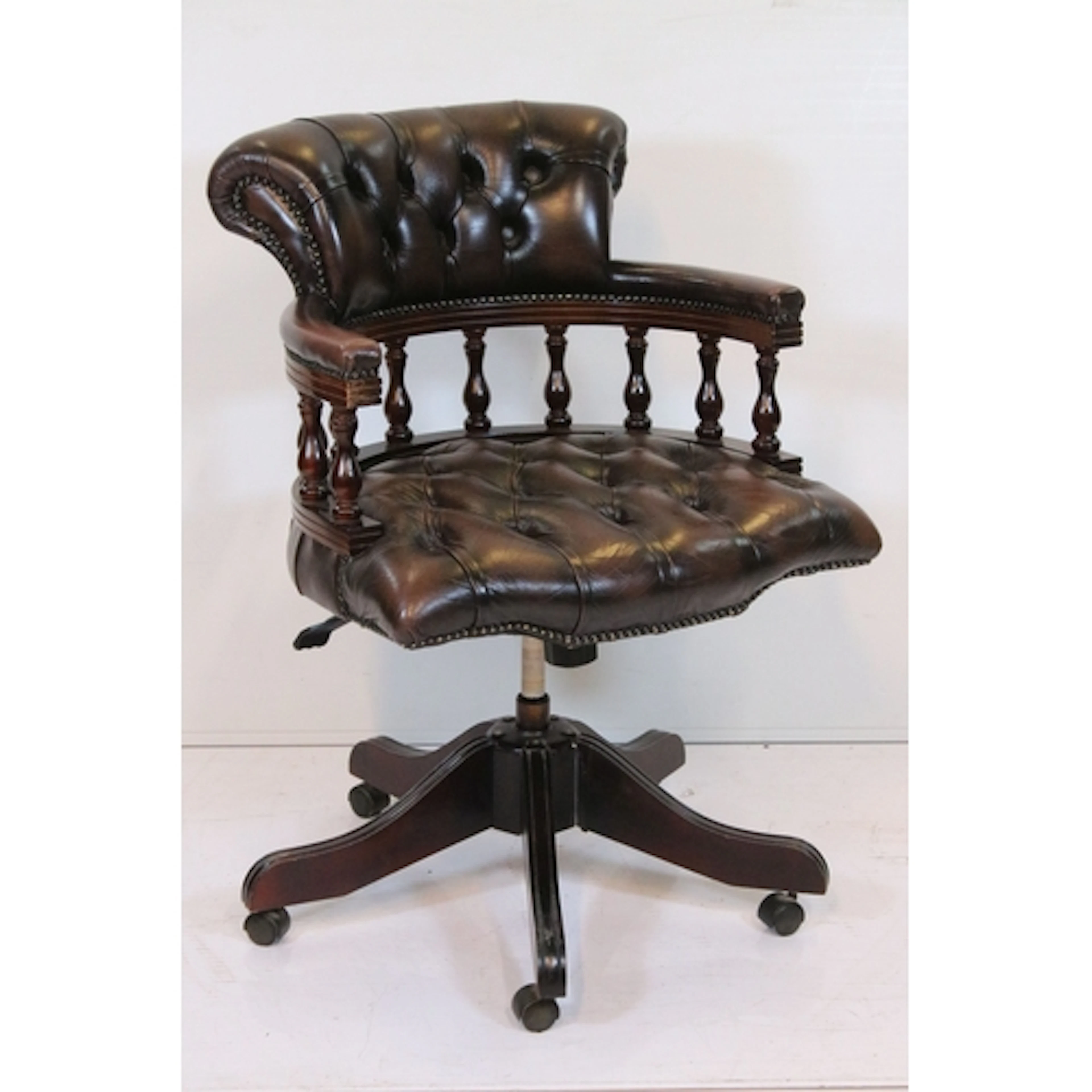 20th century button back captain's swivel armchair, having t...