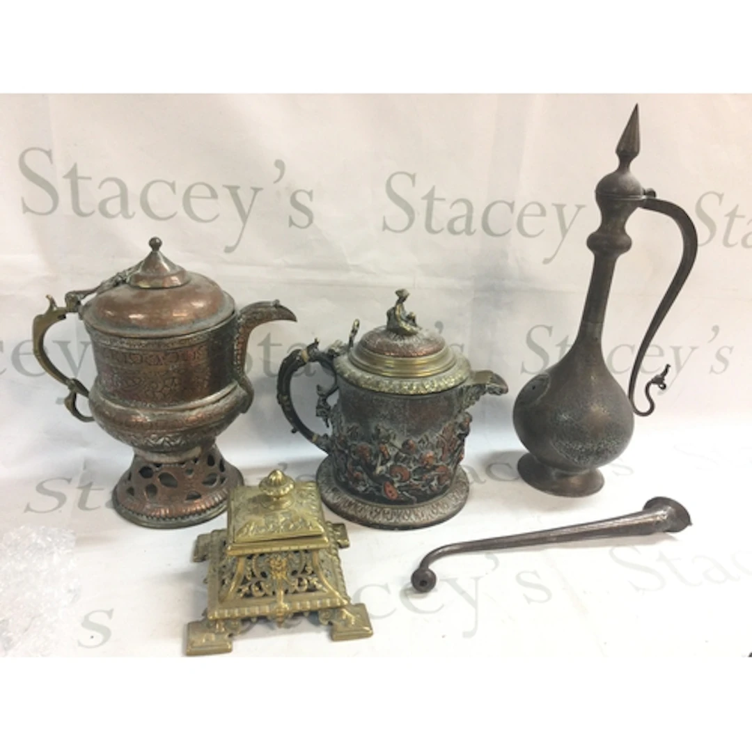 A box of metal ware including jugs, inkwell