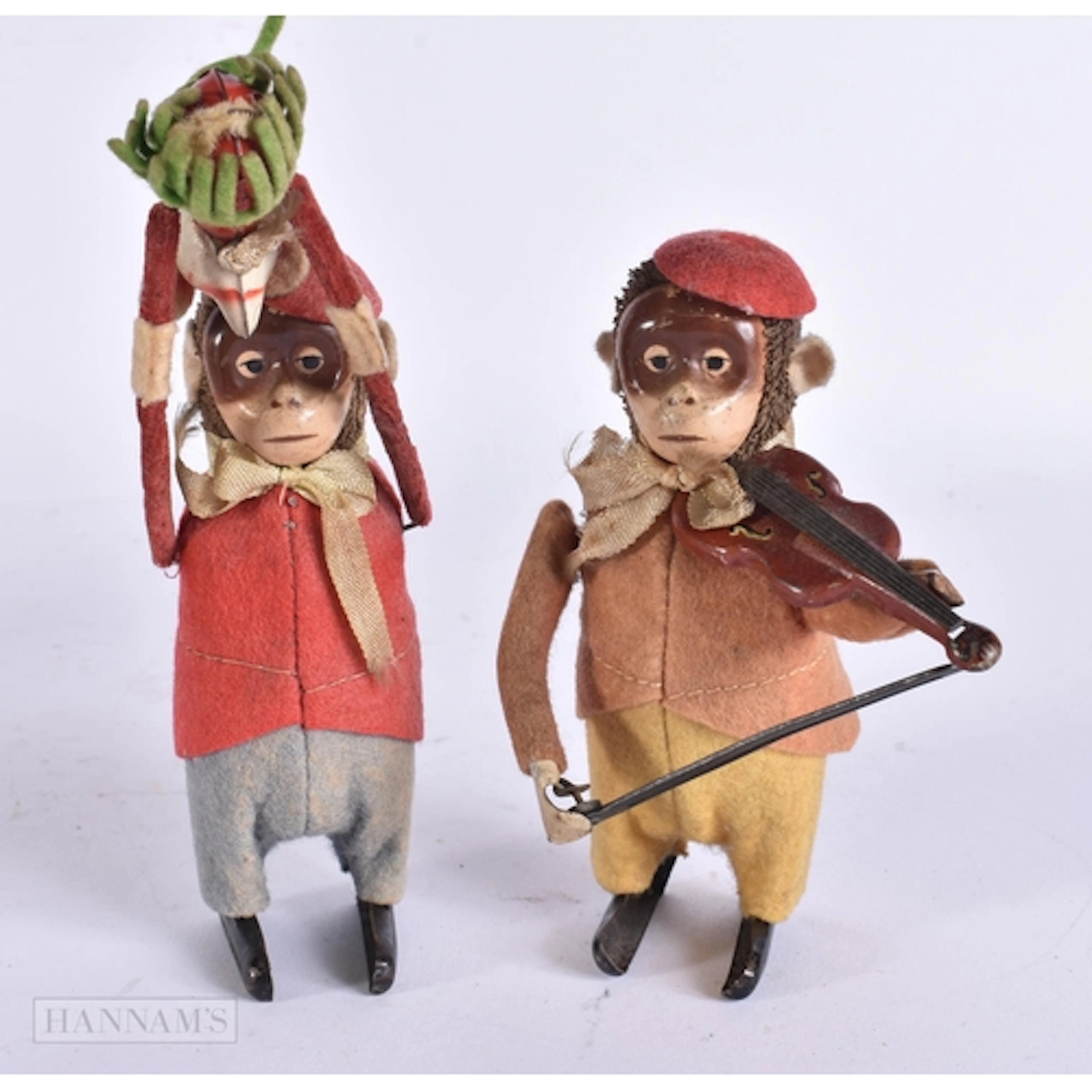 TWO VINTAGE SCHUCO WIND UP AUTOMATON MONKEYS. 14 cm high. (2...