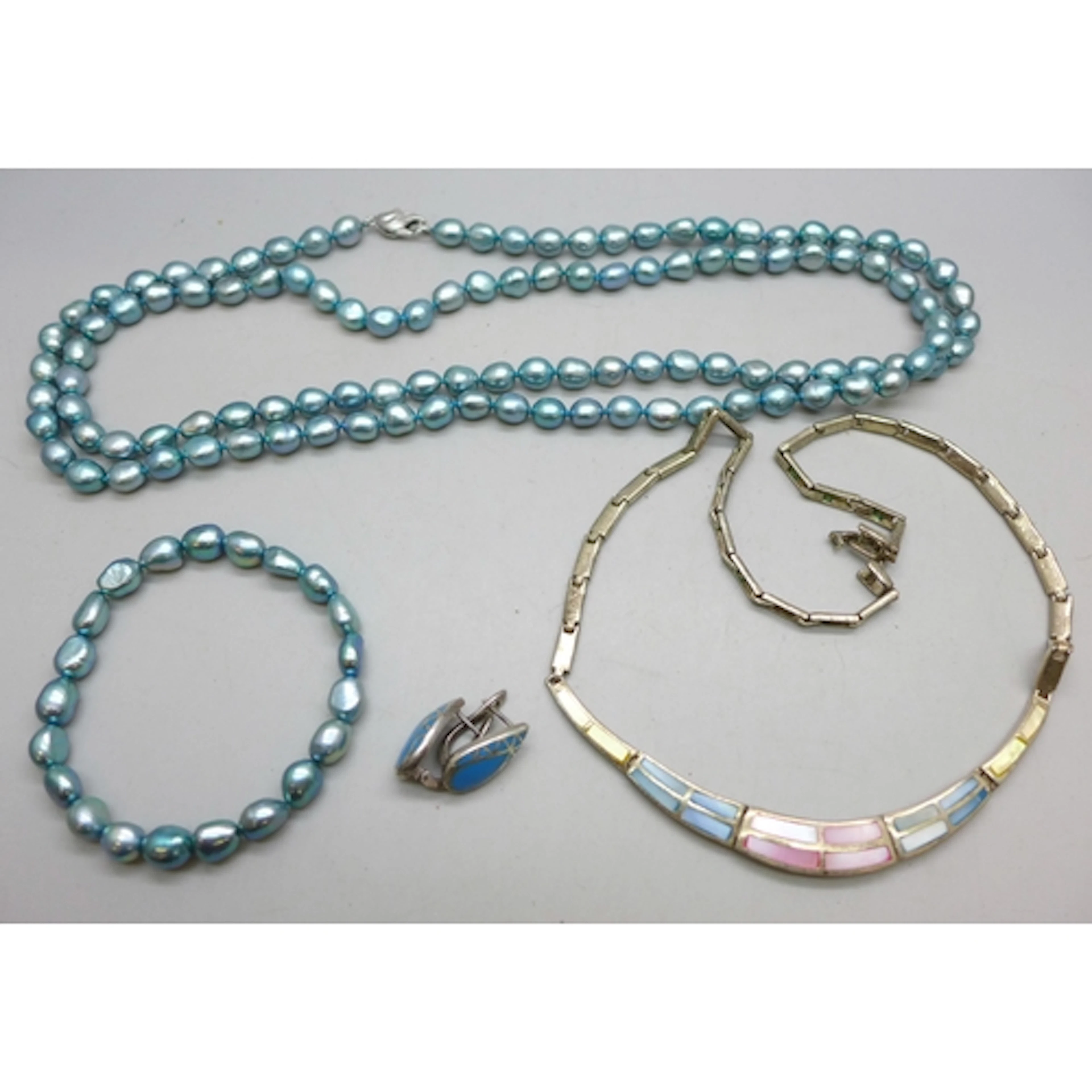 A string of Honora blue pearls with a silver clasp and match...