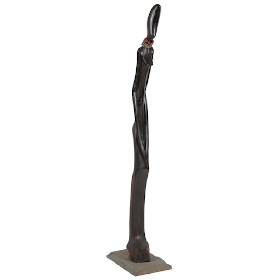A Nigerian tall standing wood figure of a woman, probably 19...