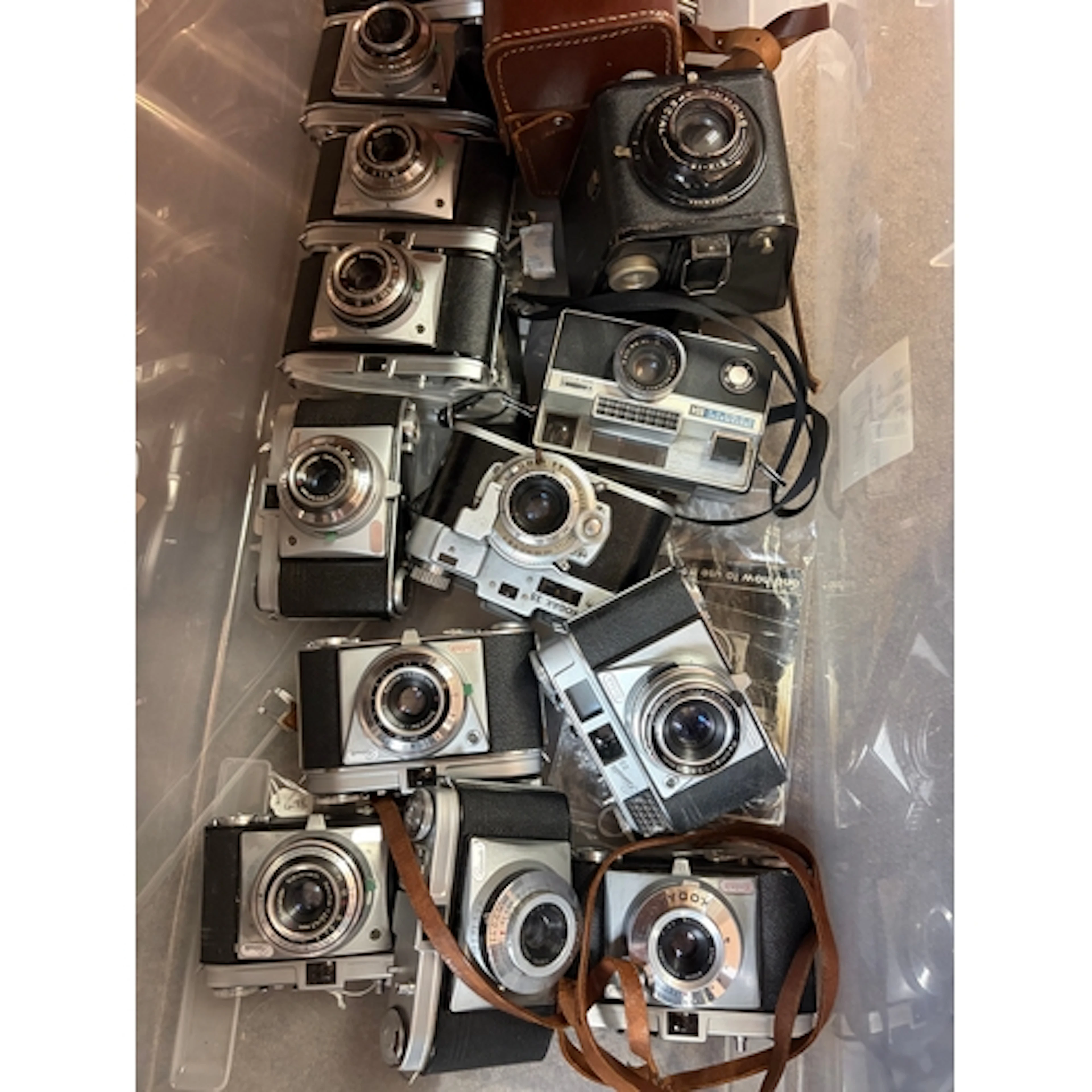 A collection of various Kodak cameras together with various ...