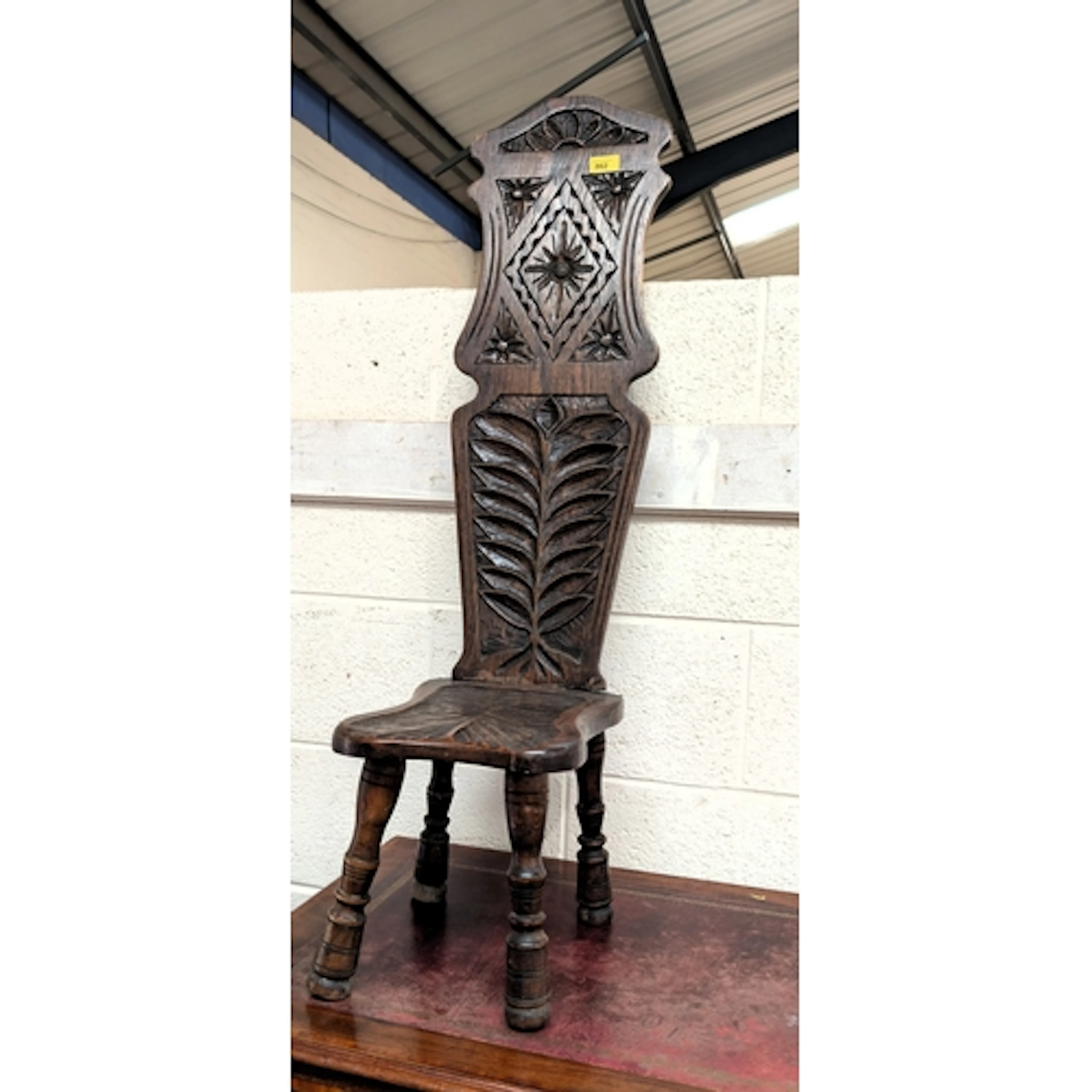 Carved oak spinning chair, Height 113cm; an oak fretwork mir...