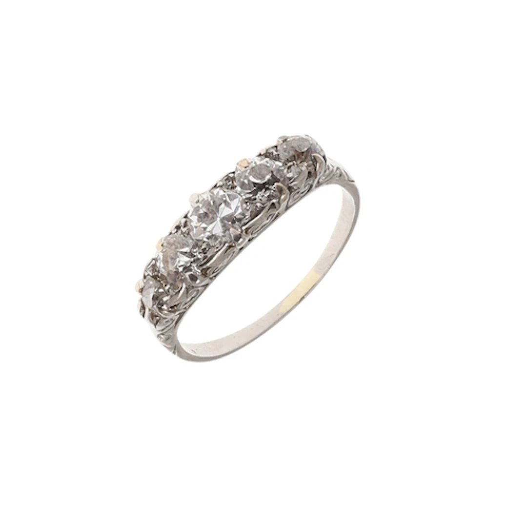 A DIAMOND FIVE STONE RING. mounted with five graduated circu...