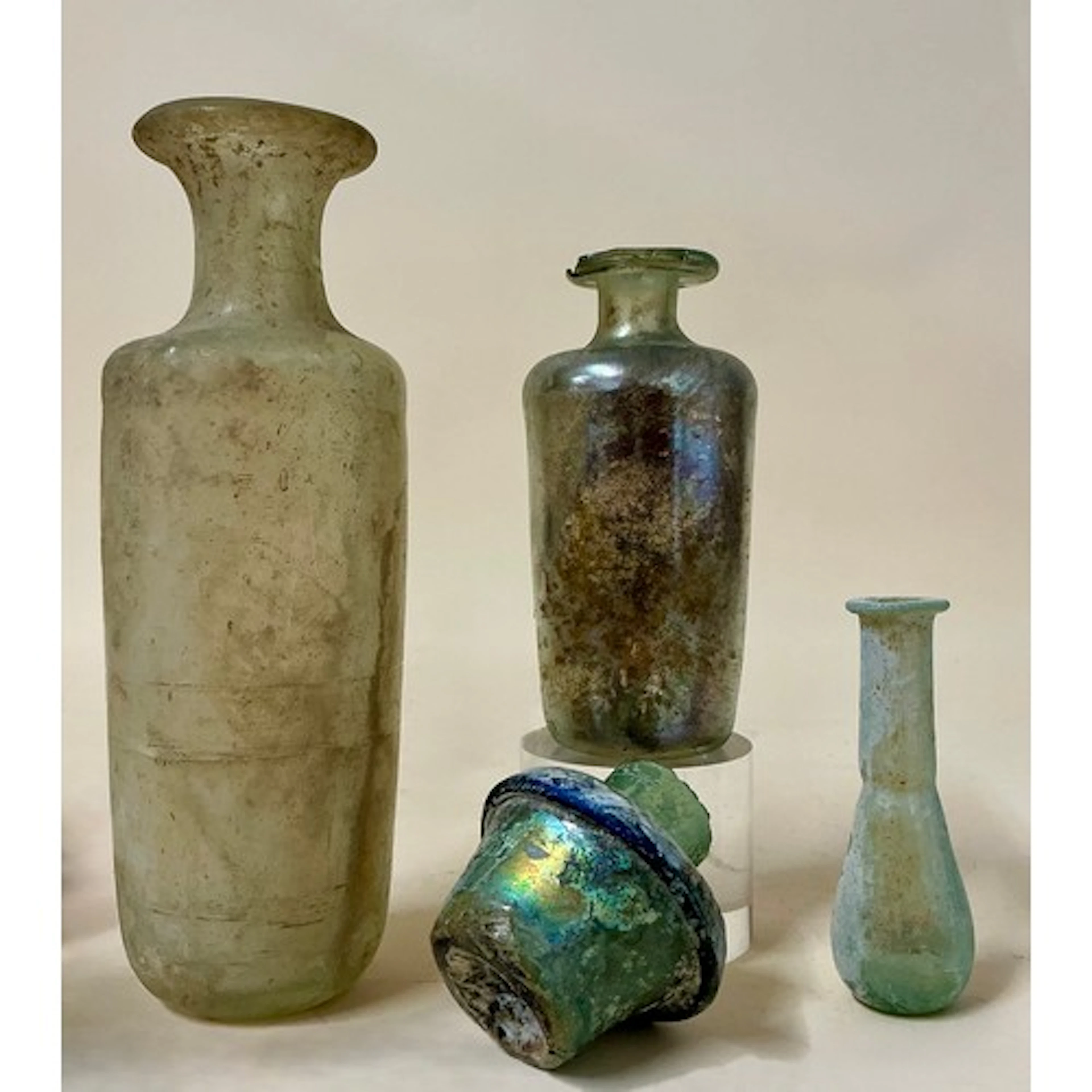 Antiquities - a Roman glass group including a glass unguenta...