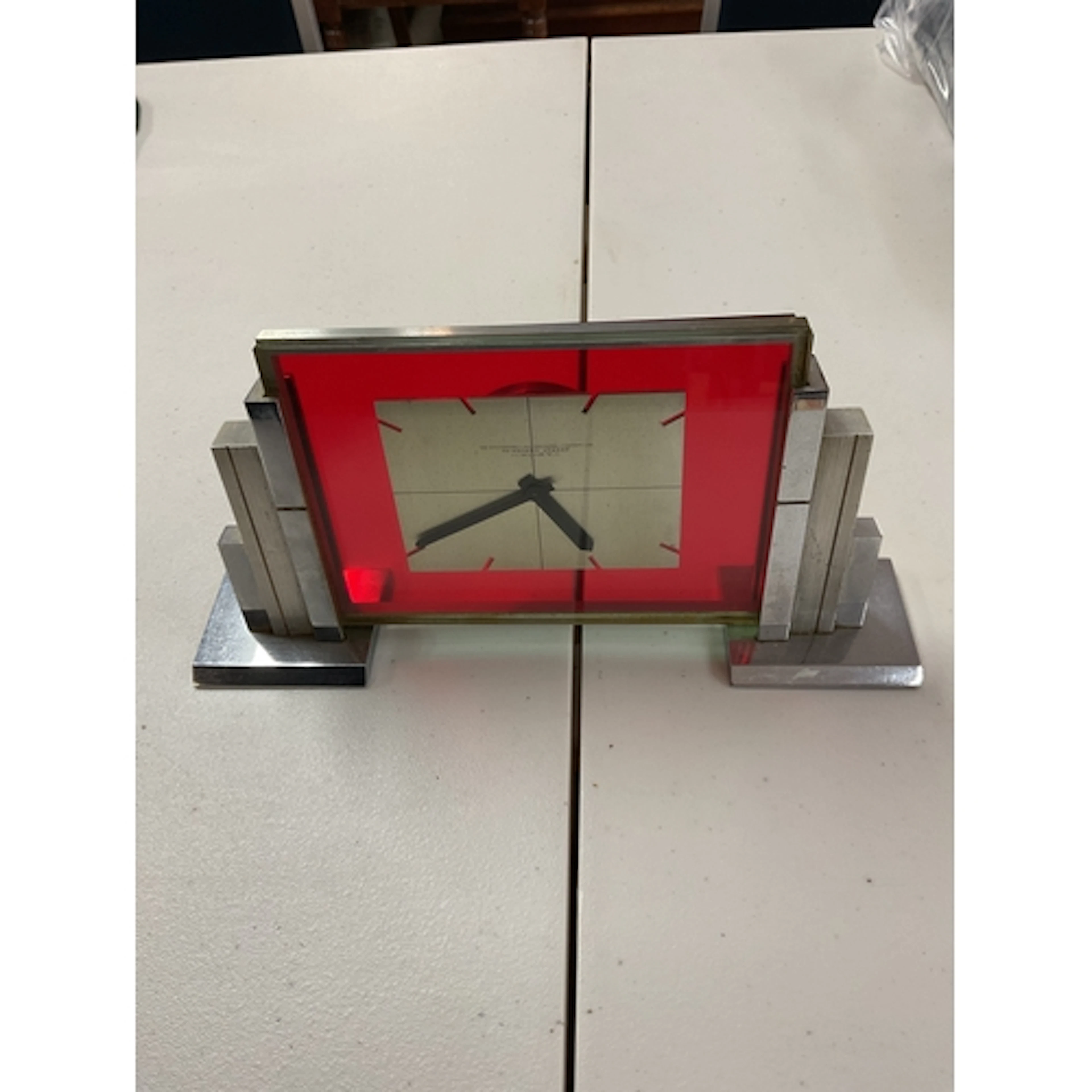 Imhof Art Deco mantle clock in chrome, with glass front sign...