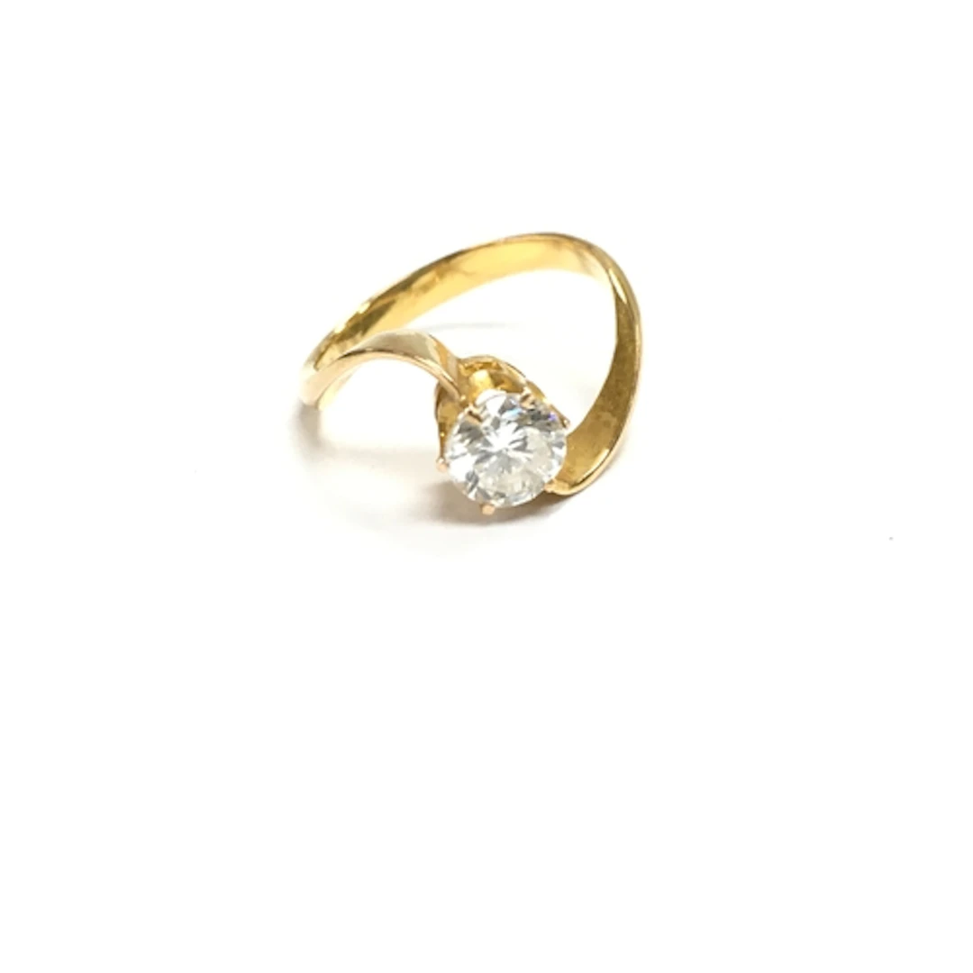 An unmarked gold diamond solitaire ring. approx J 1/2 ...