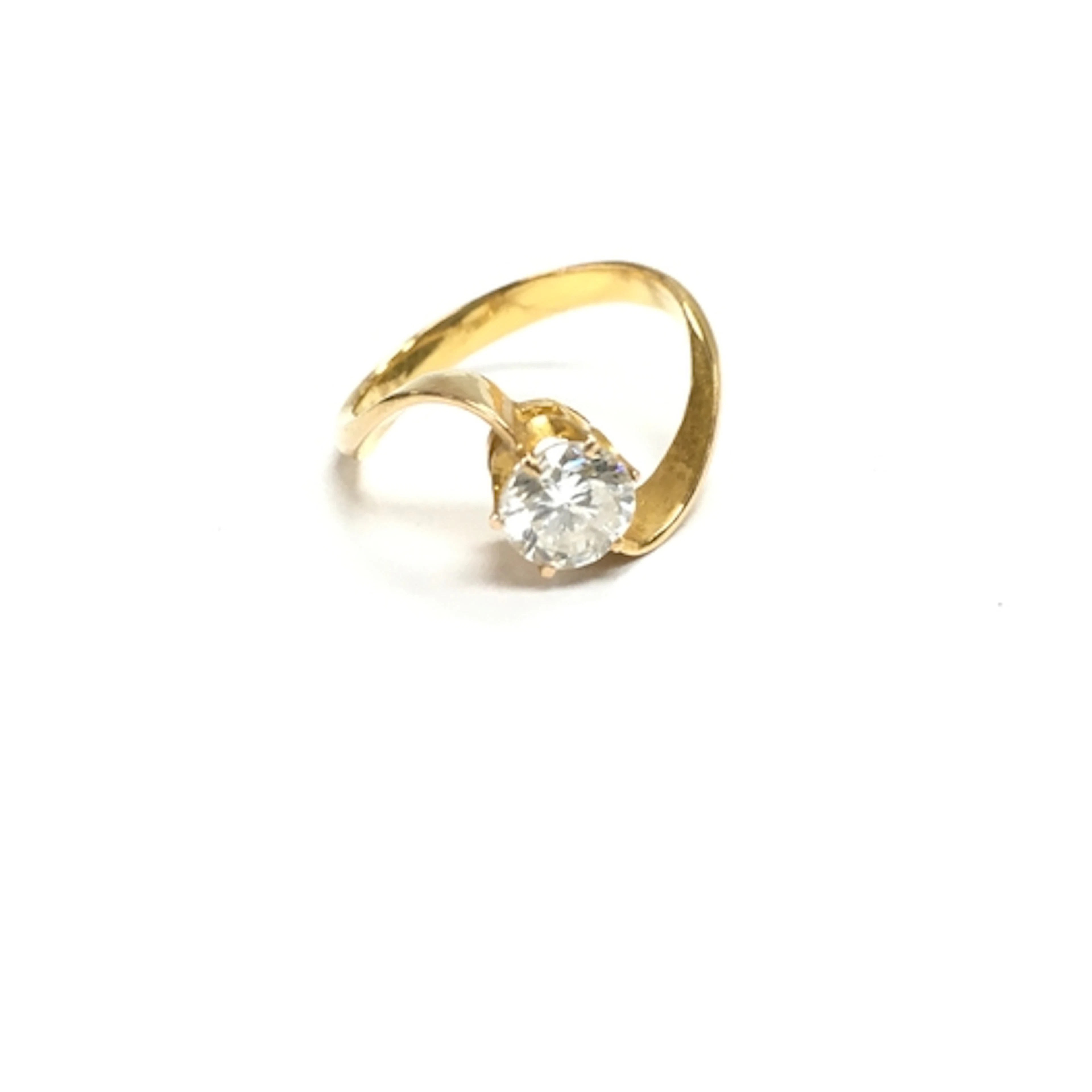 An unmarked gold diamond solitaire ring. approx J 1/2 ...