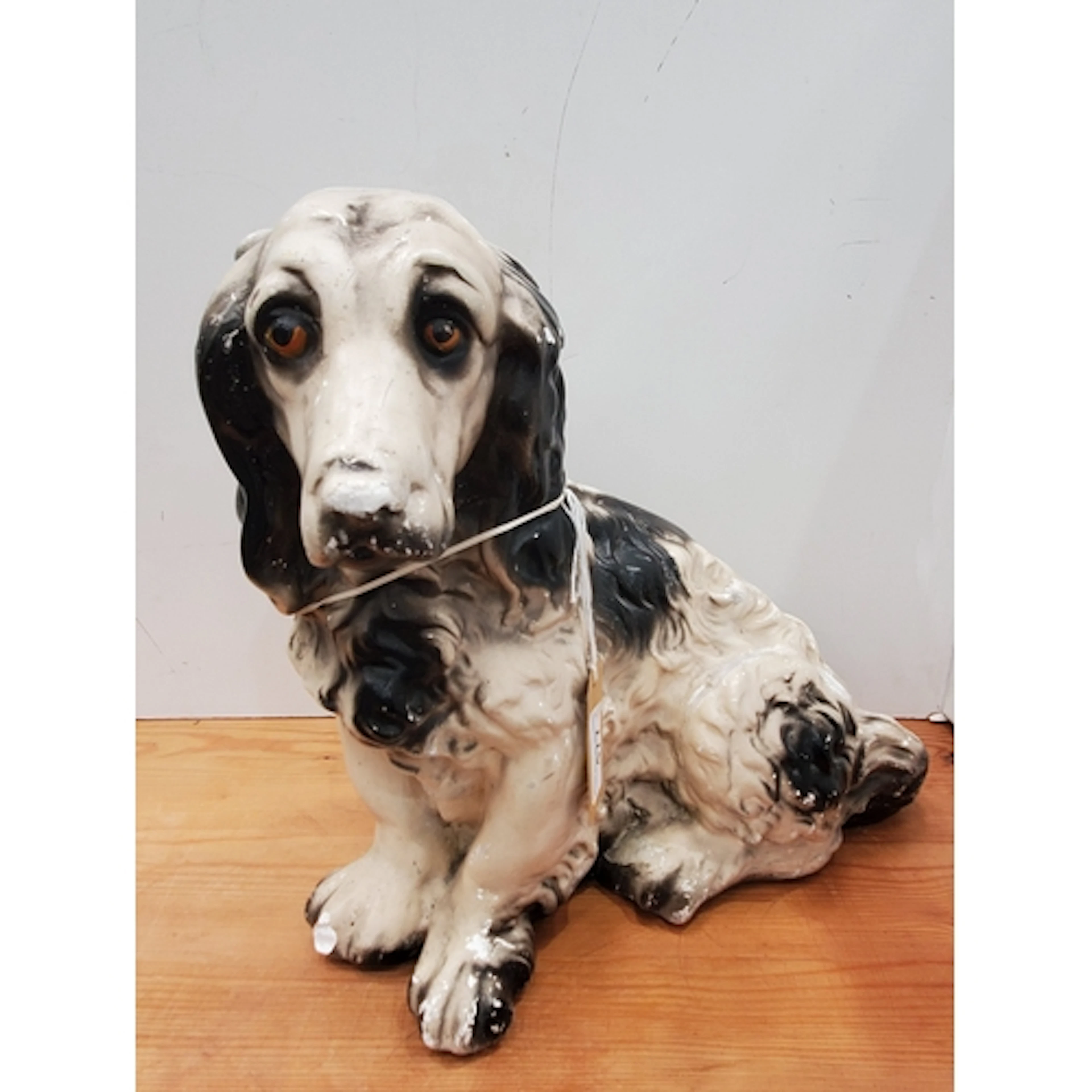 A painted plaster model of a Spaniel, 14in H, A/F, needs a g...