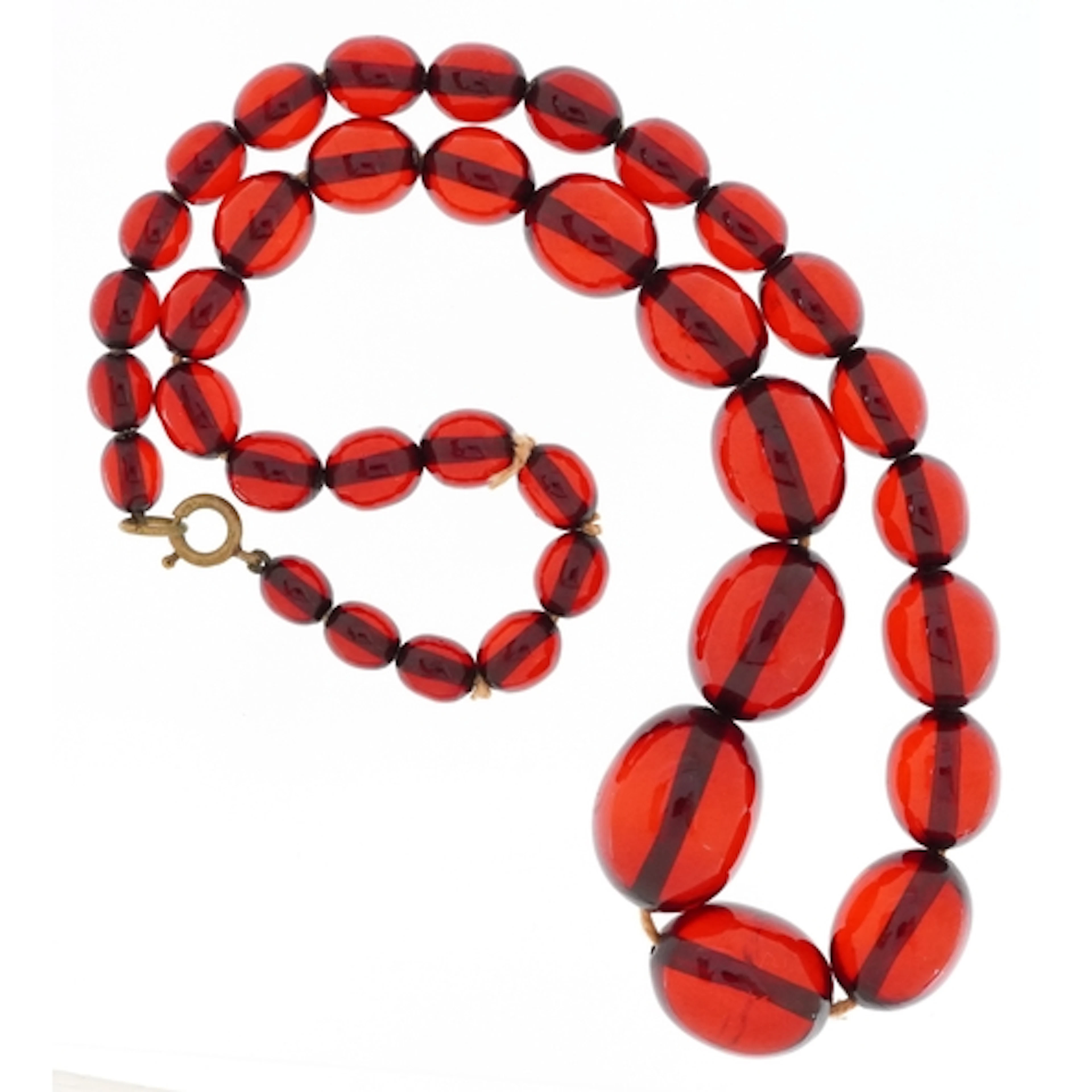 Graduated cherry amber coloured bead necklace, the largest b...