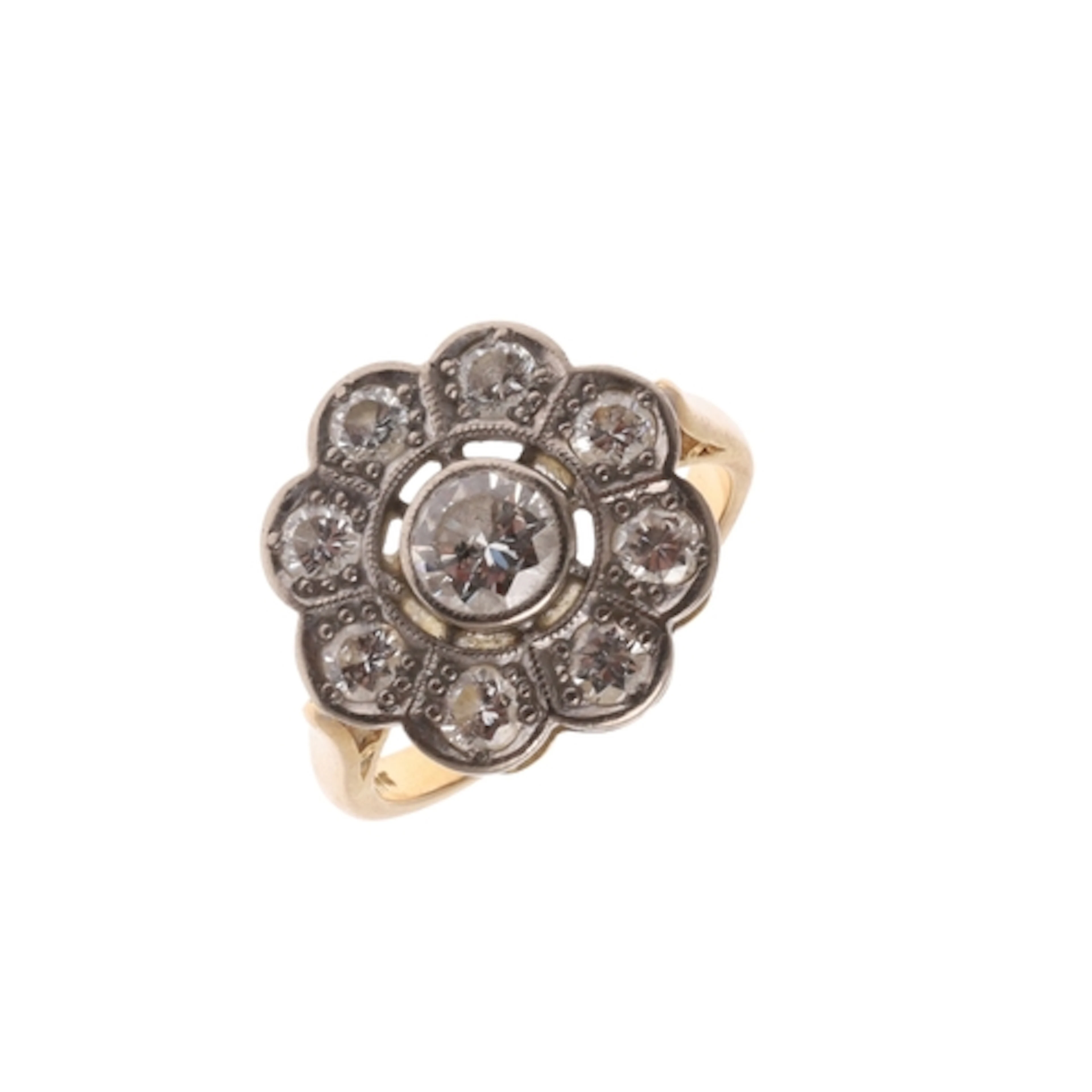A DIAMOND CLUSTER RING. of flowerhead design, the central ci...