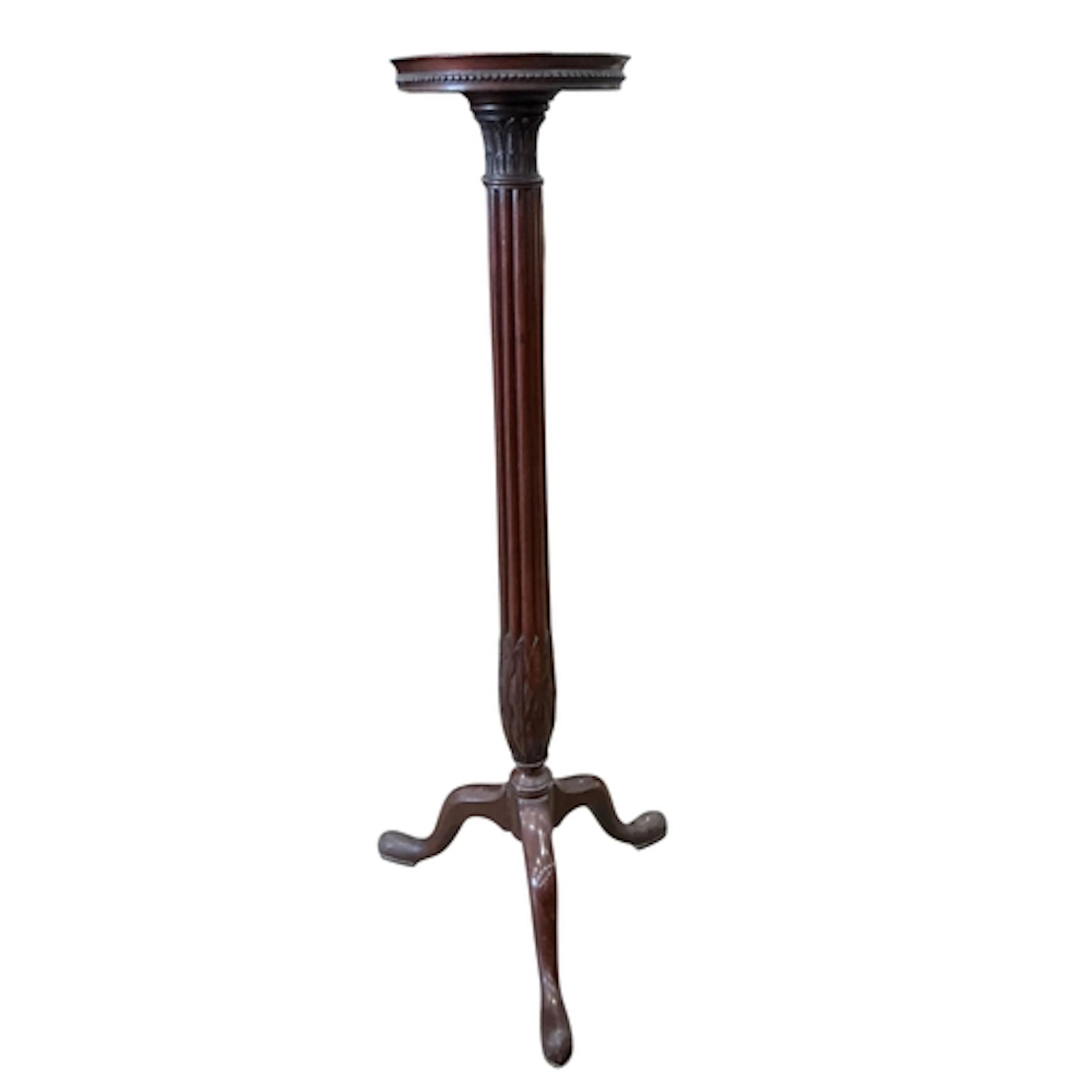A mahogany torchere, width 55cm, depth 55cm, height 128cm...