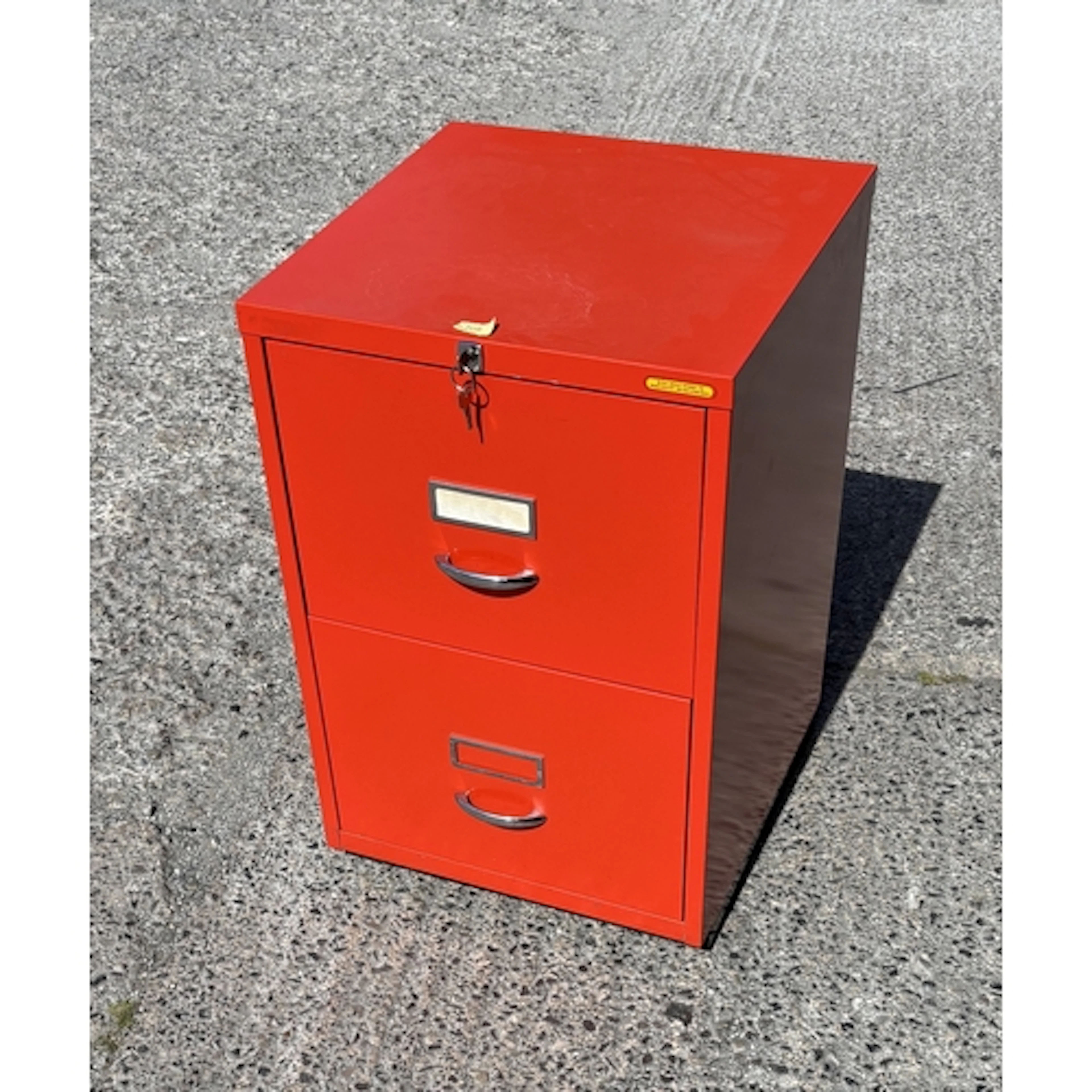 A red industrial 2 drawer filing cabinet.
