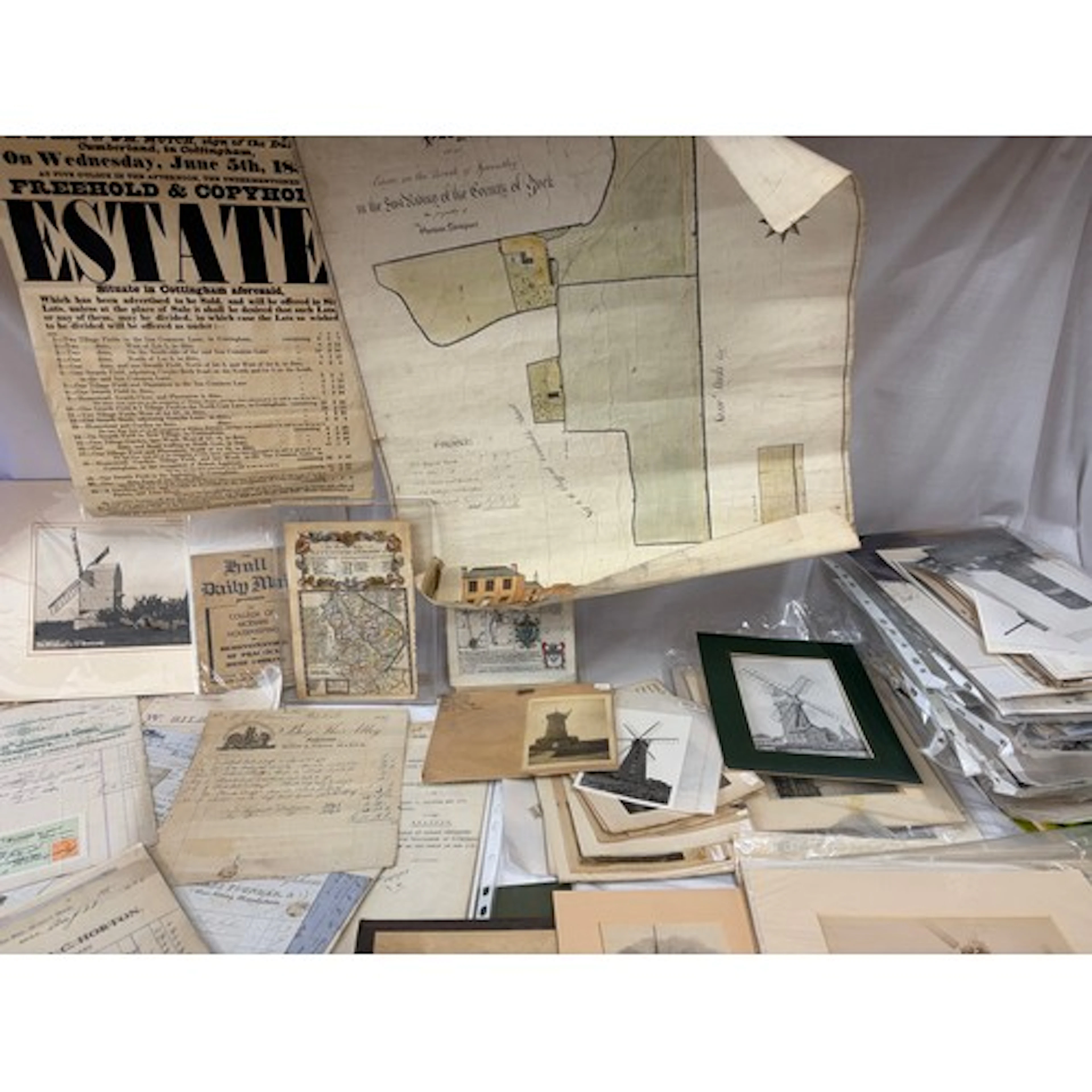 A large collection of photographs, postcards, coloured print...