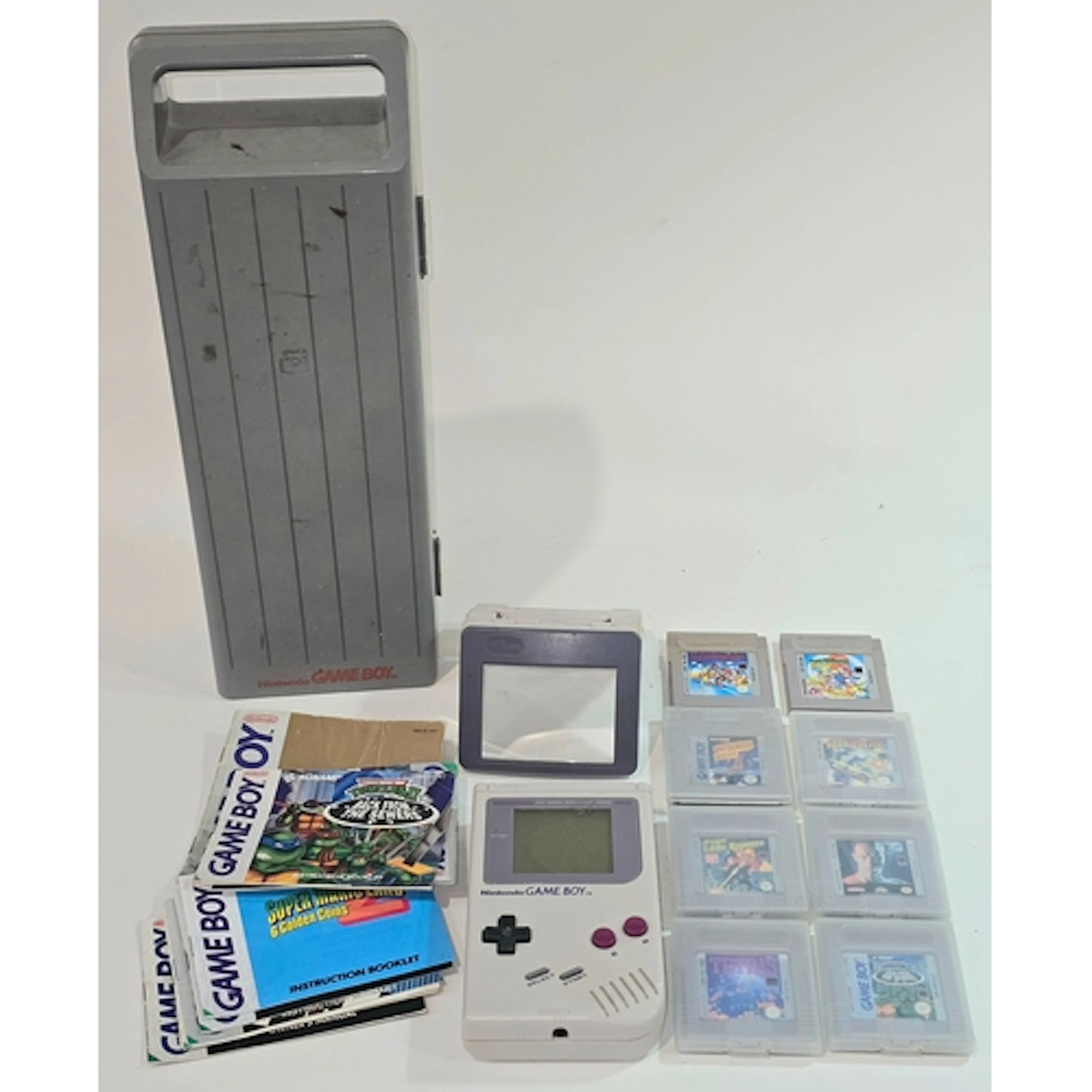 Vintage Nintendo Game Boy handheld console in Game Boy brand...