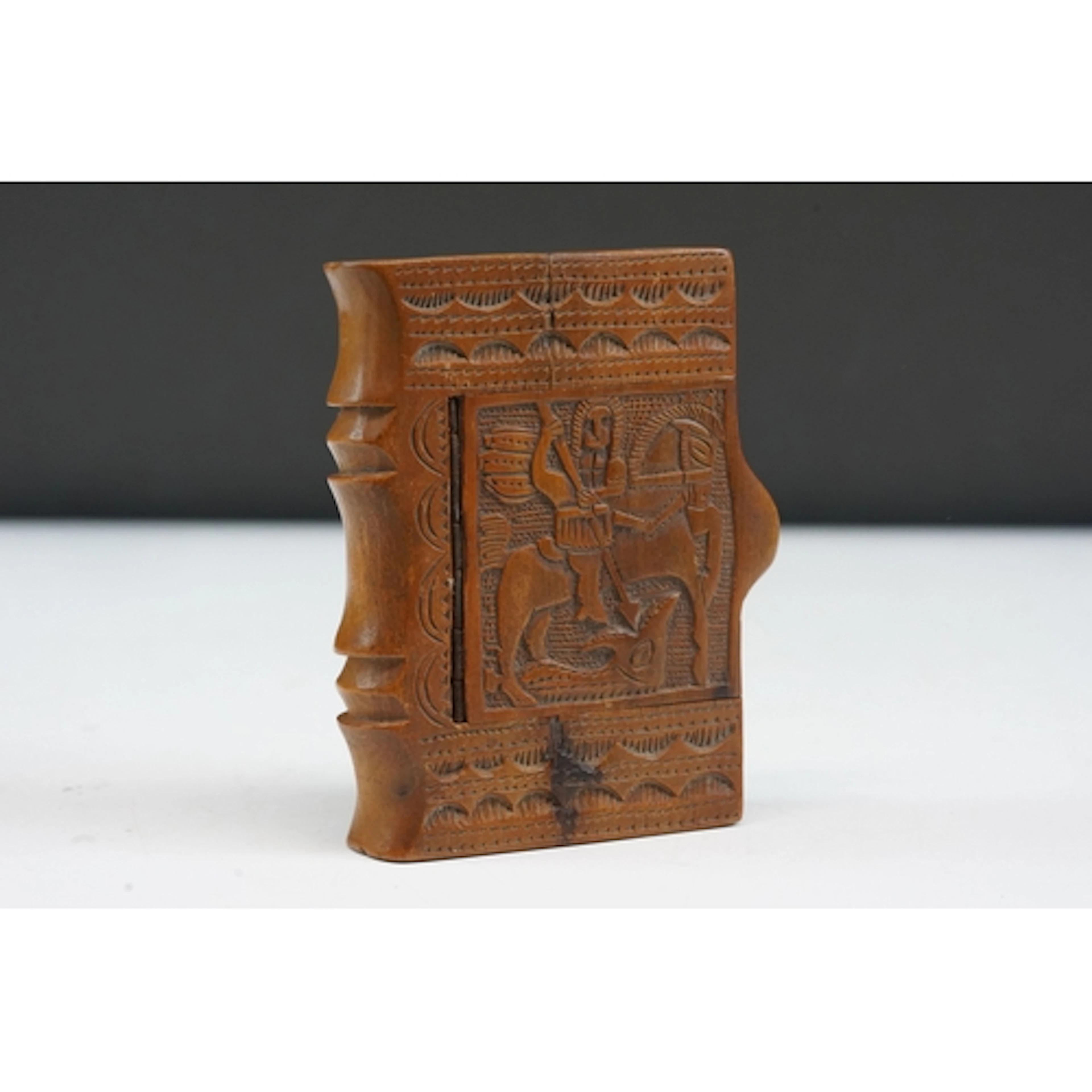 Folk art treen snuff box in the form of a book, the top carv...