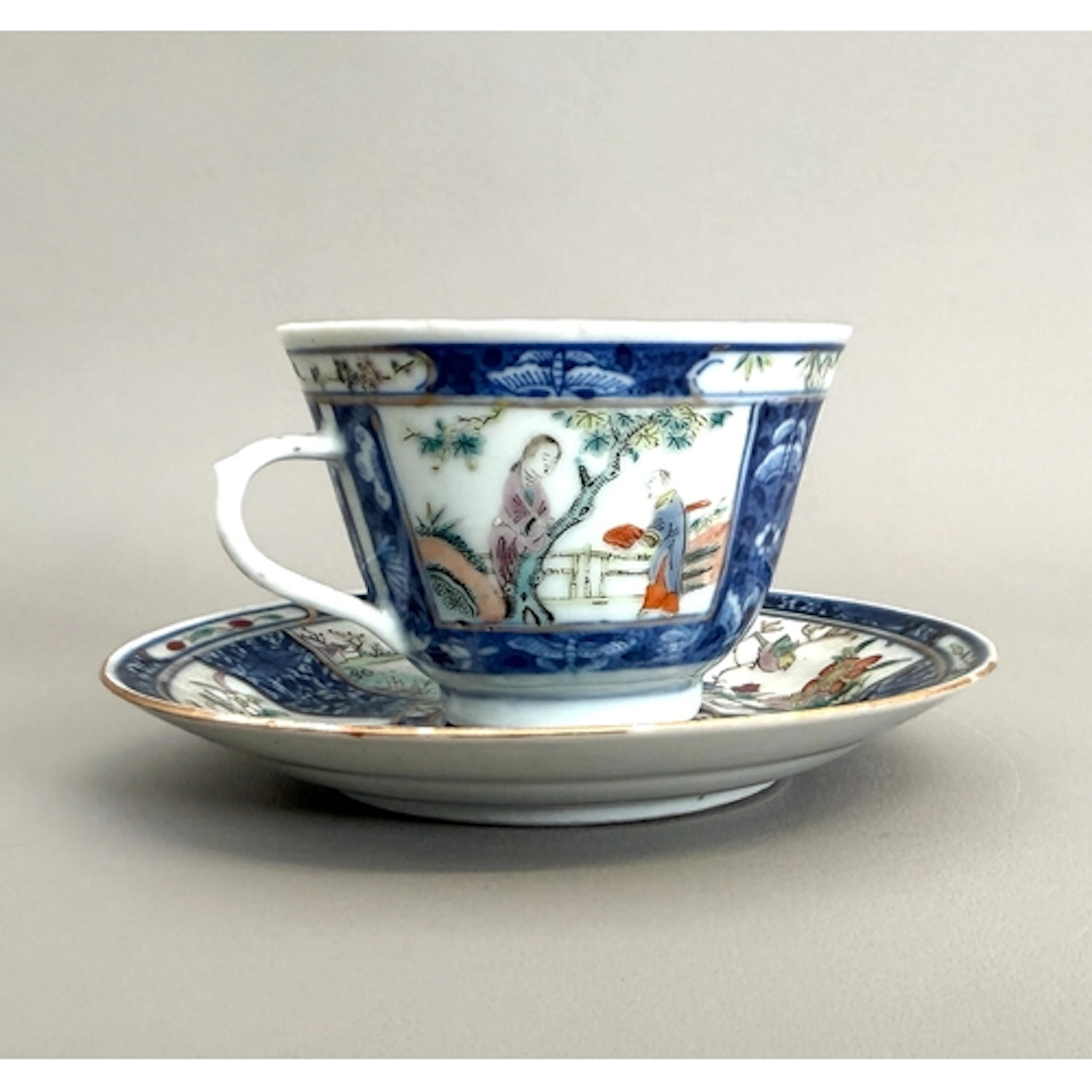 A Chinese porcelain cup and saucer - with four character mar...