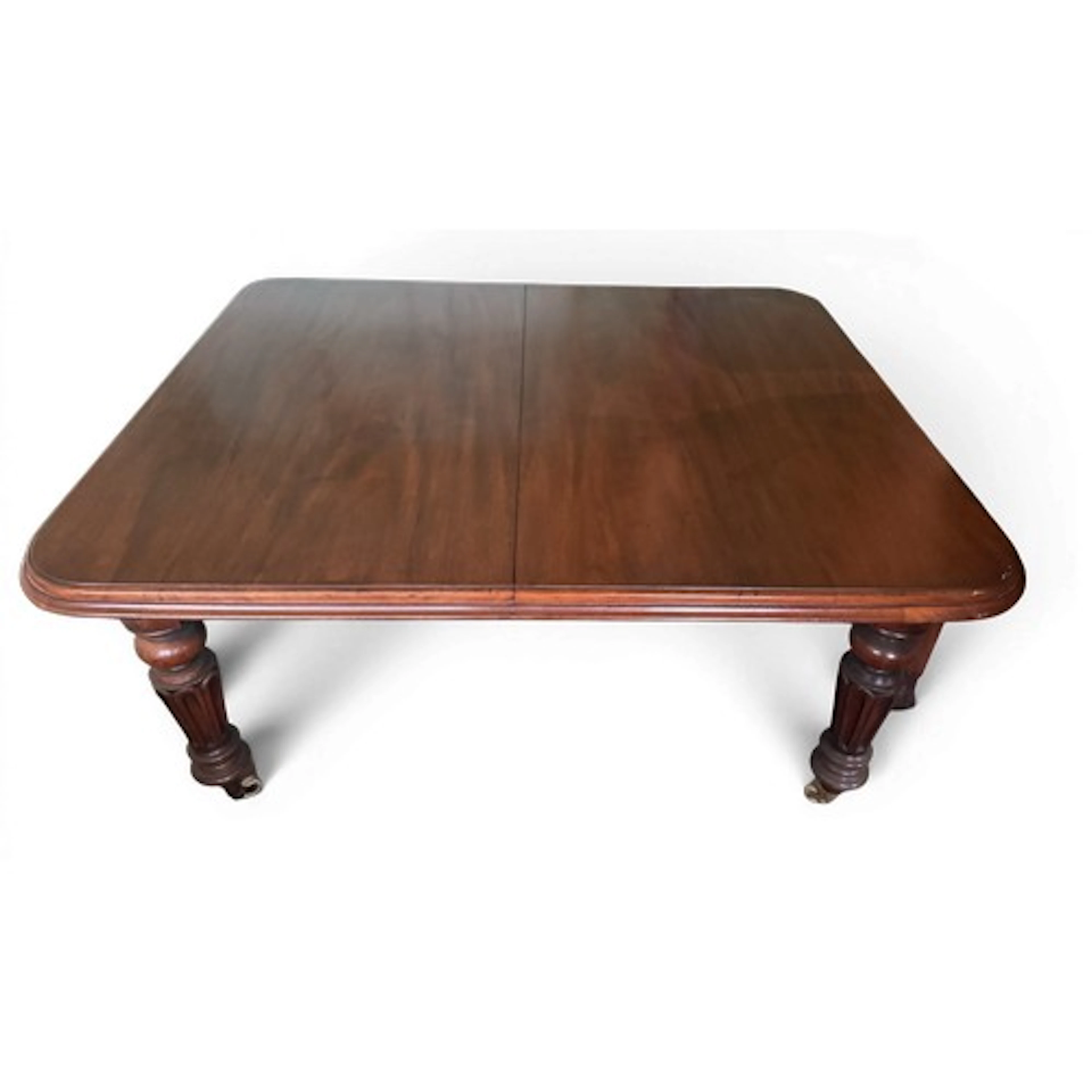 A 19thC mahogany wind out dining table with two extra leaves...