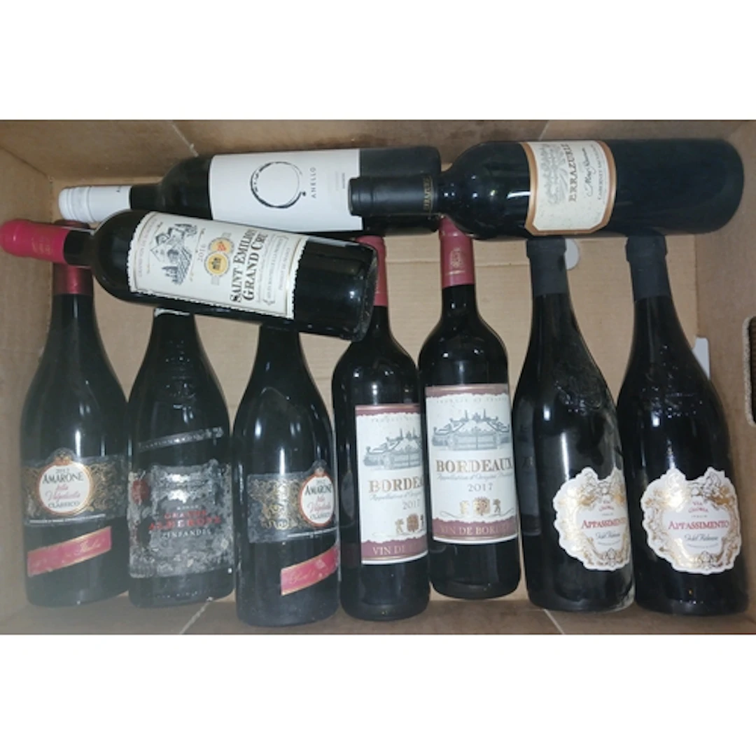 Five boxes of assorted red wines.