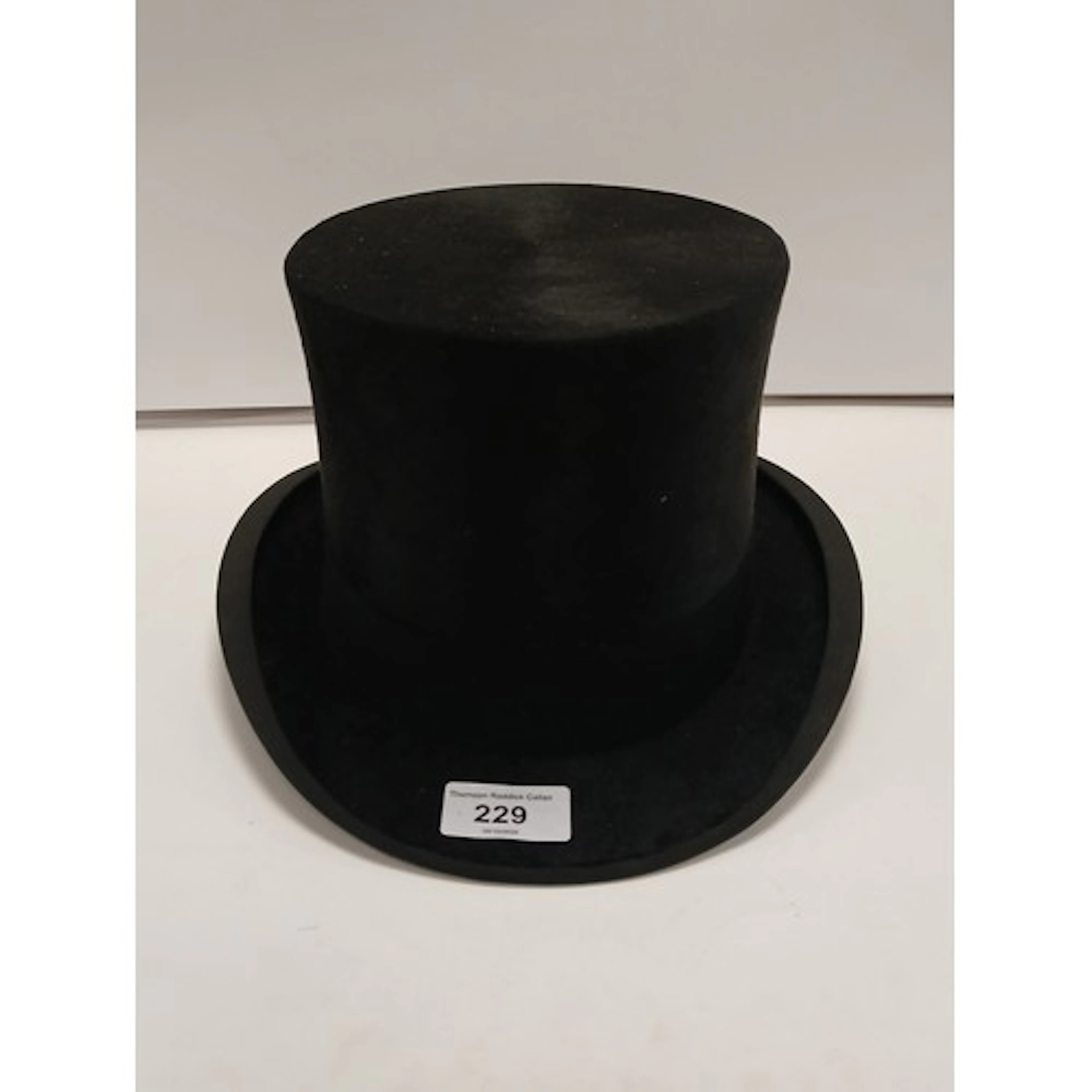 Black silk top hat, Paisleys Limited.
