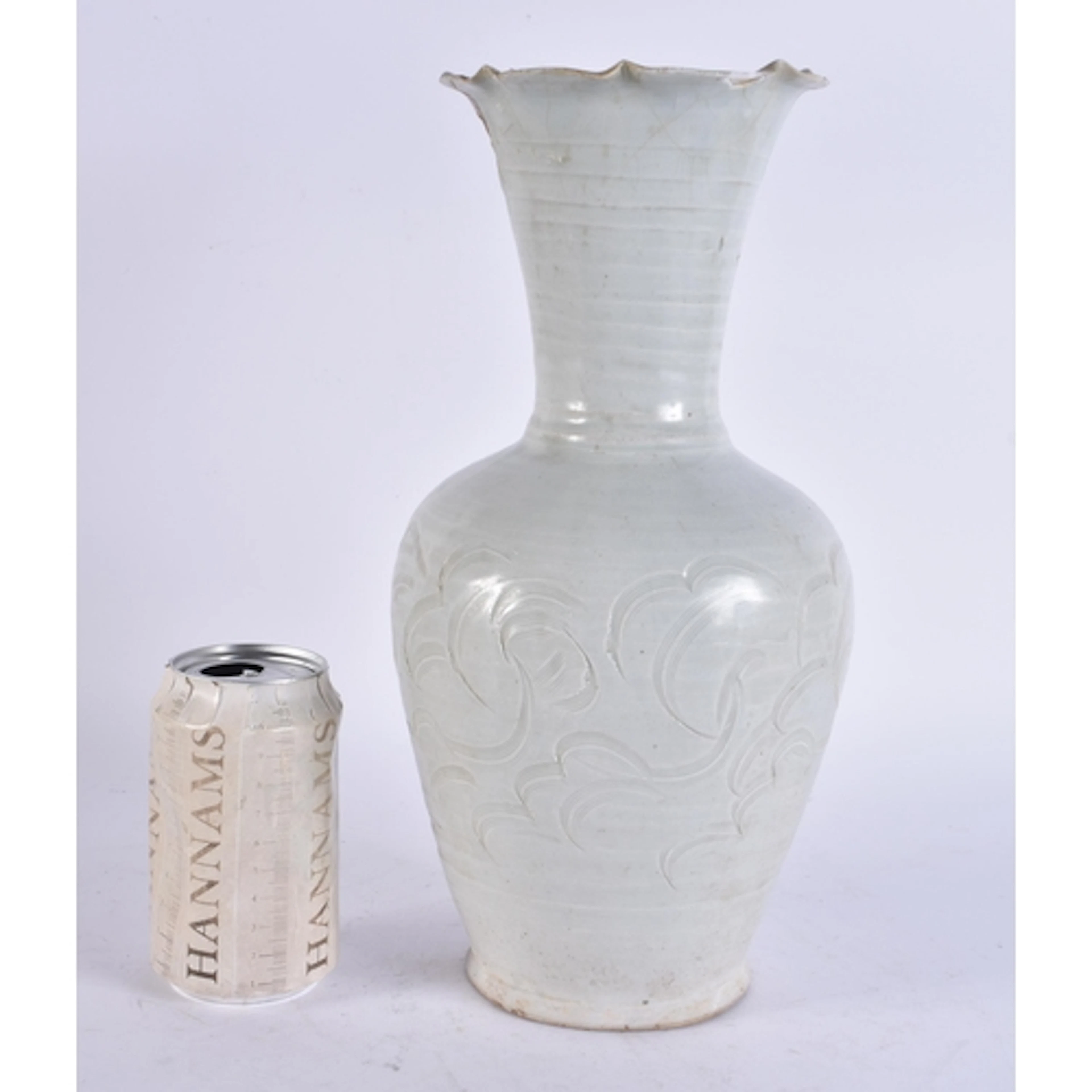 A RARE LARGE EARLY CHINESE QINGBAI VASE incised with foliage...