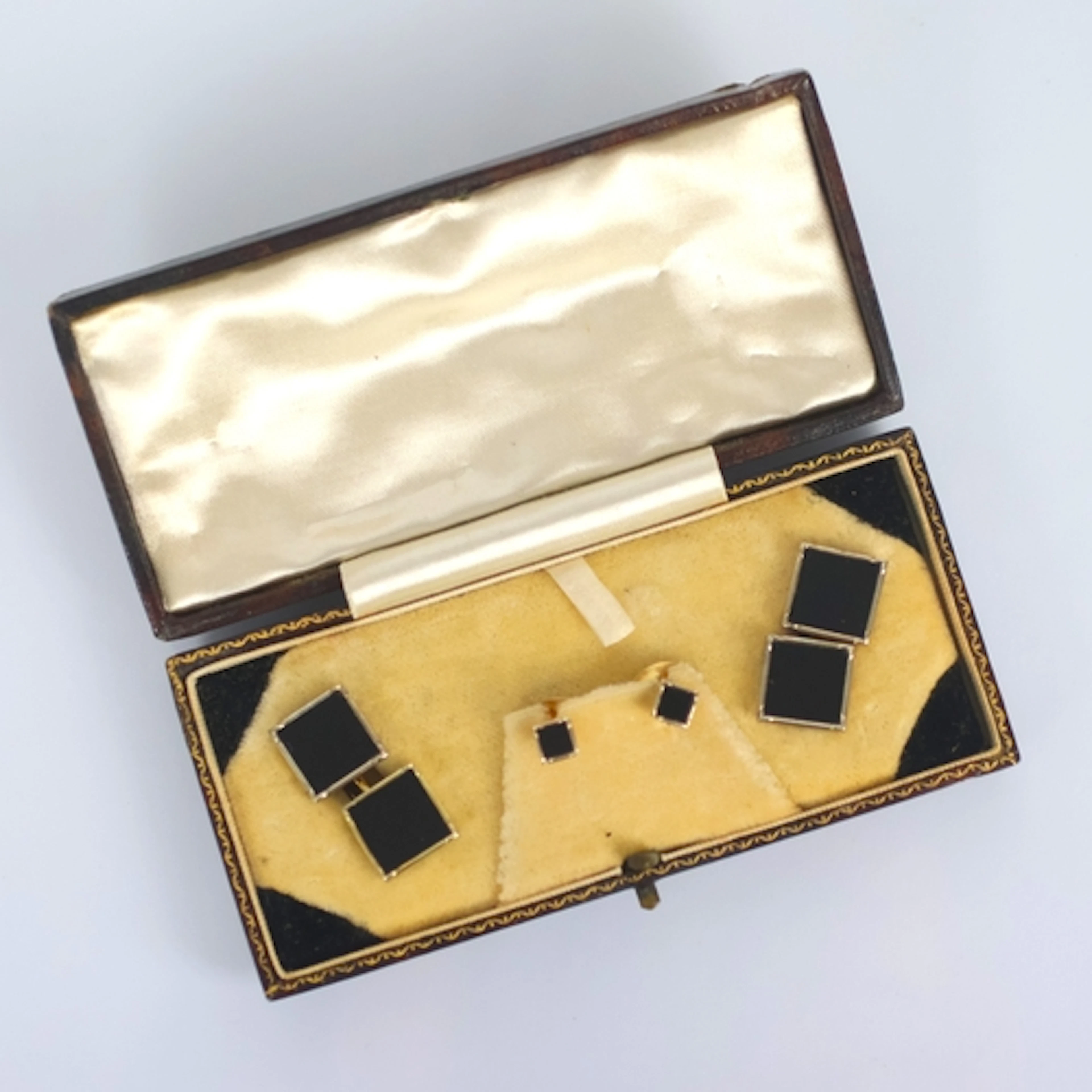An early 20th century cased set of dress studs, comprising c...