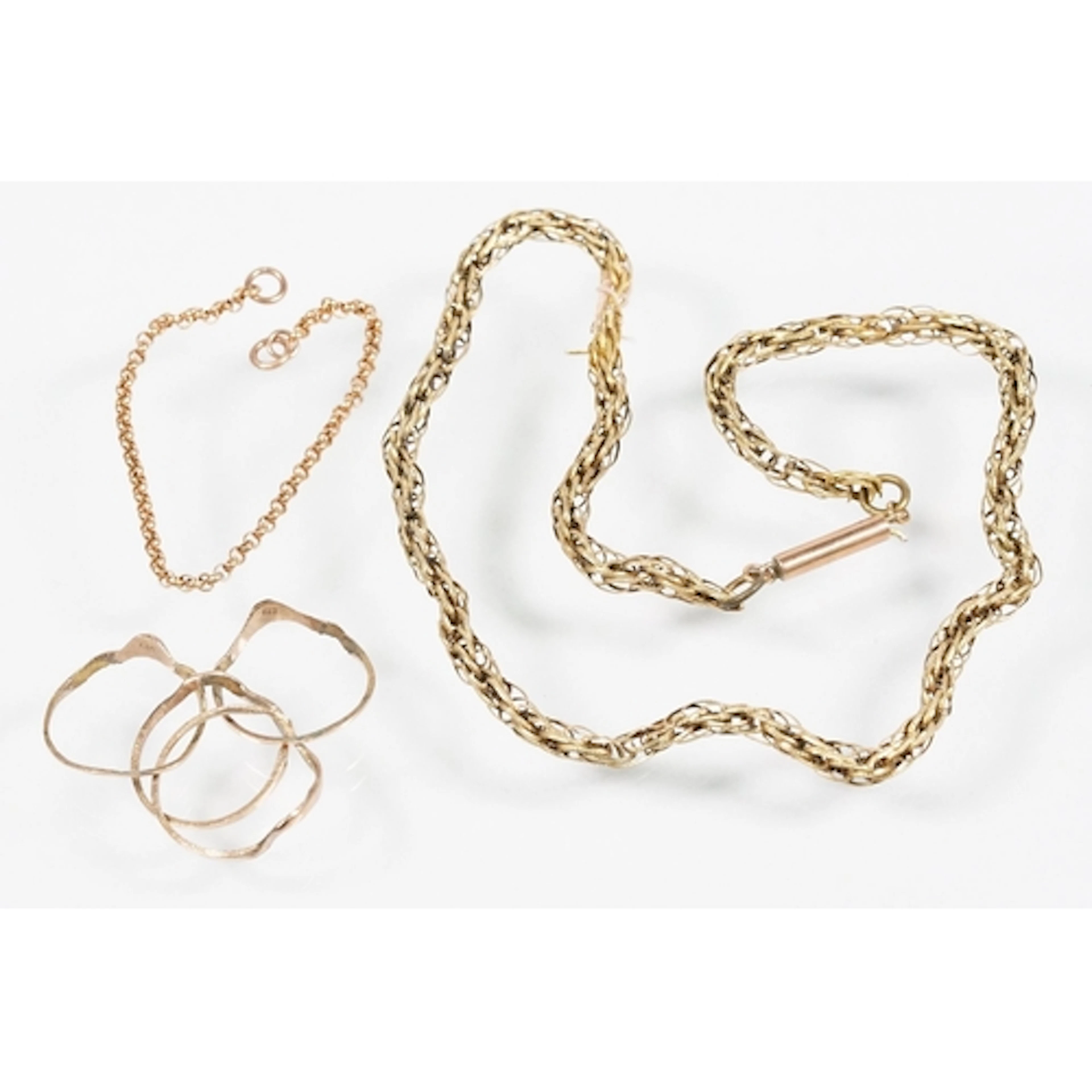 Two yellow metal chains to include a rope twist chain with c...