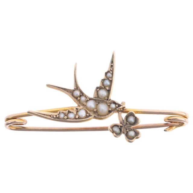 An Art Nouveau Edwardian 9ct pearl swallow bar brooch, Murrl...