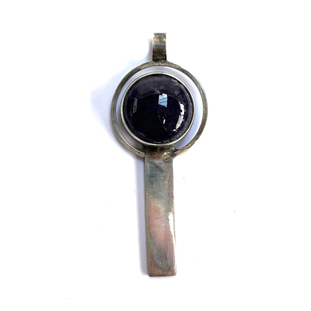 A Modernist Georg Jensen style silver and amethyst pendant, ...