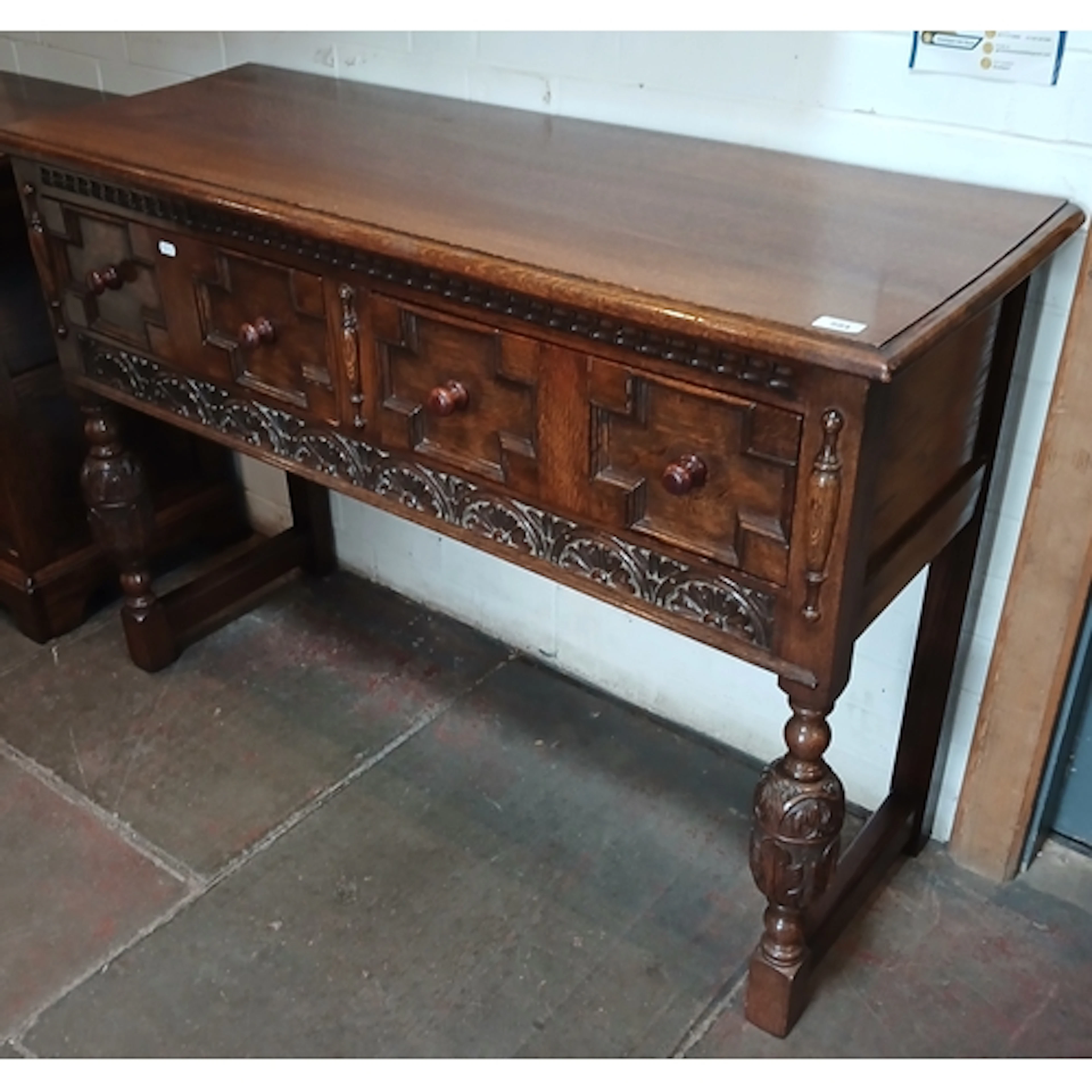 A reproduction oak two drawer dresser base.