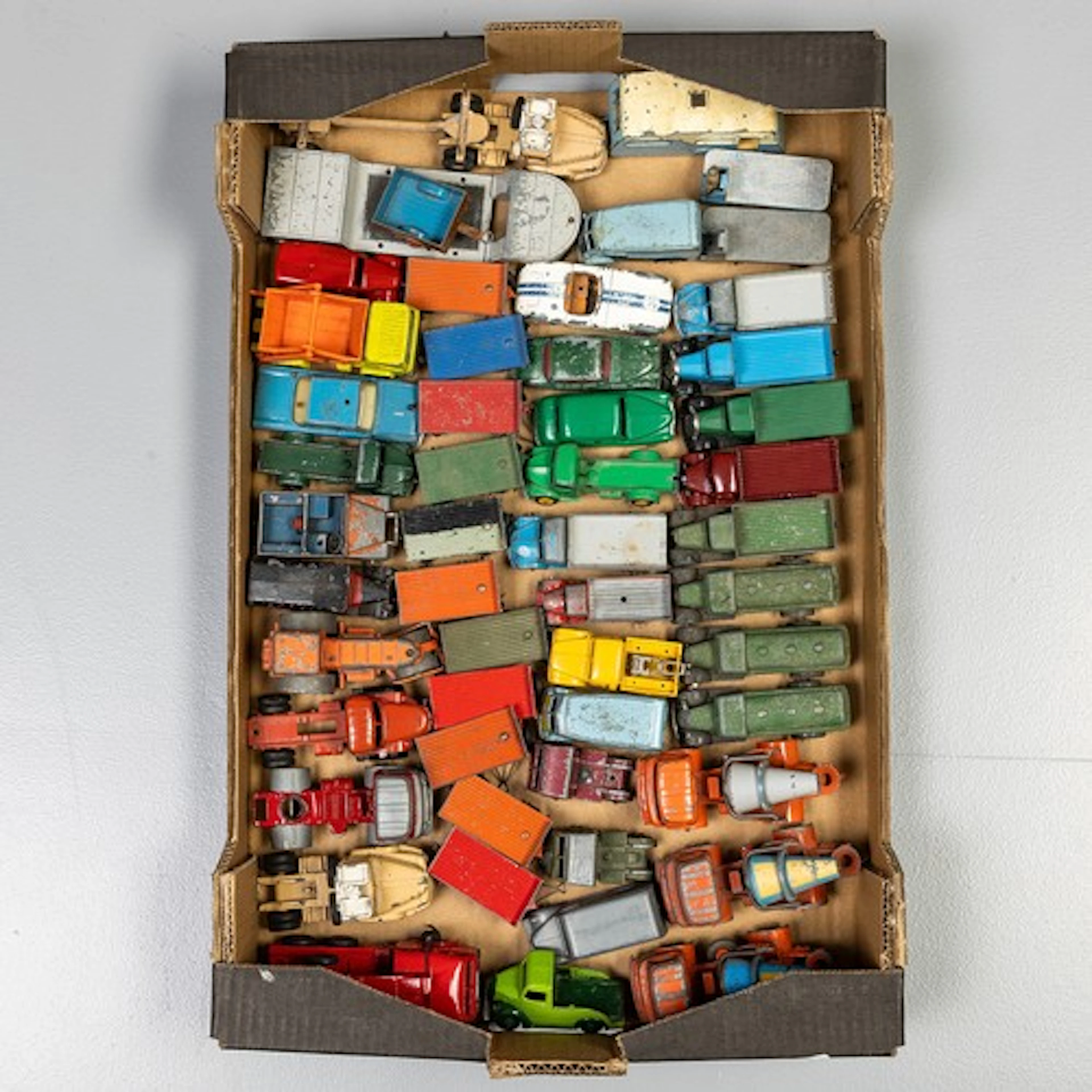 Fruit tray containing unboxed playworn Dinky models to inclu...