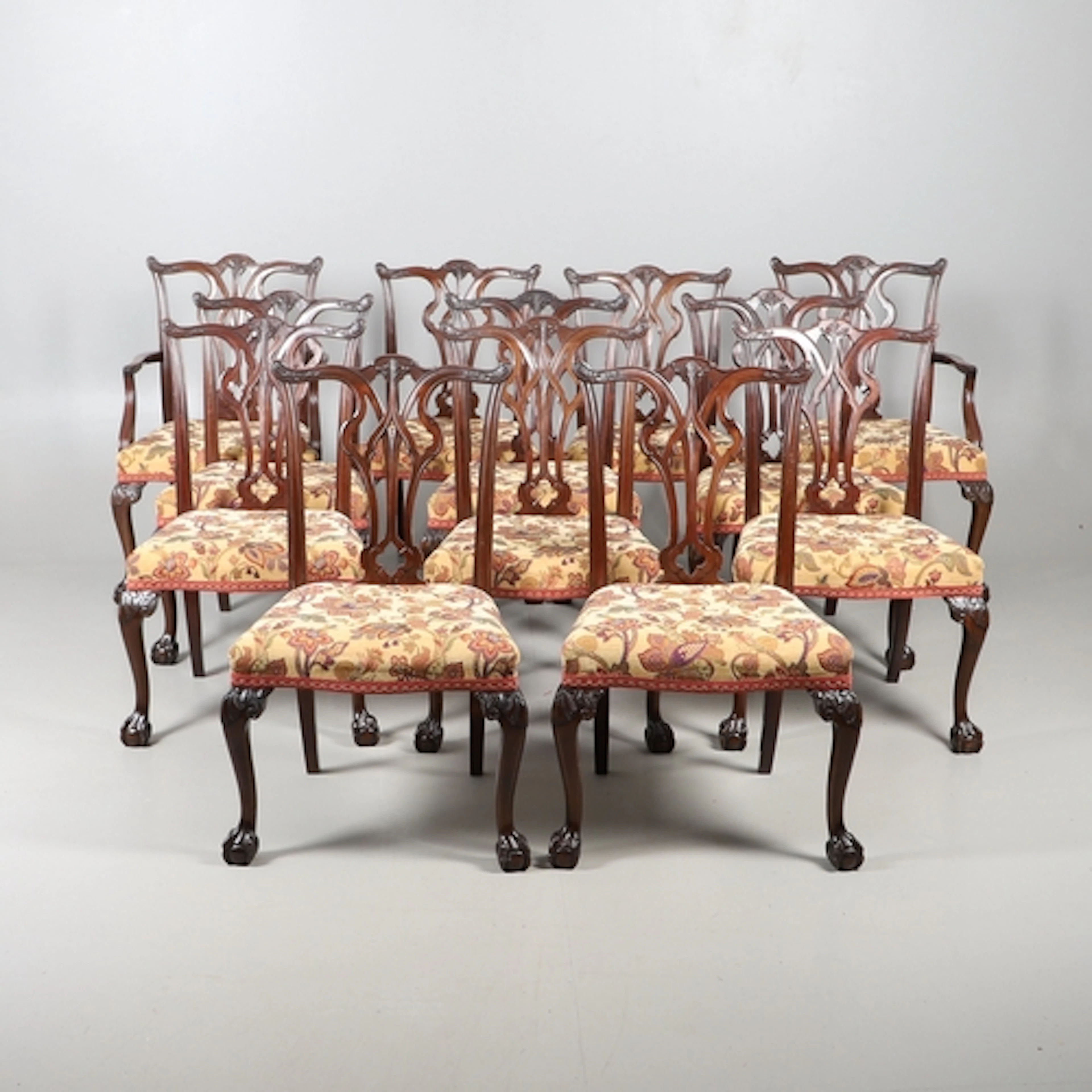 A SET OF TWELVE CHIPPENDALE STYLE MAHOGANY DINING CHAIRS. 20...