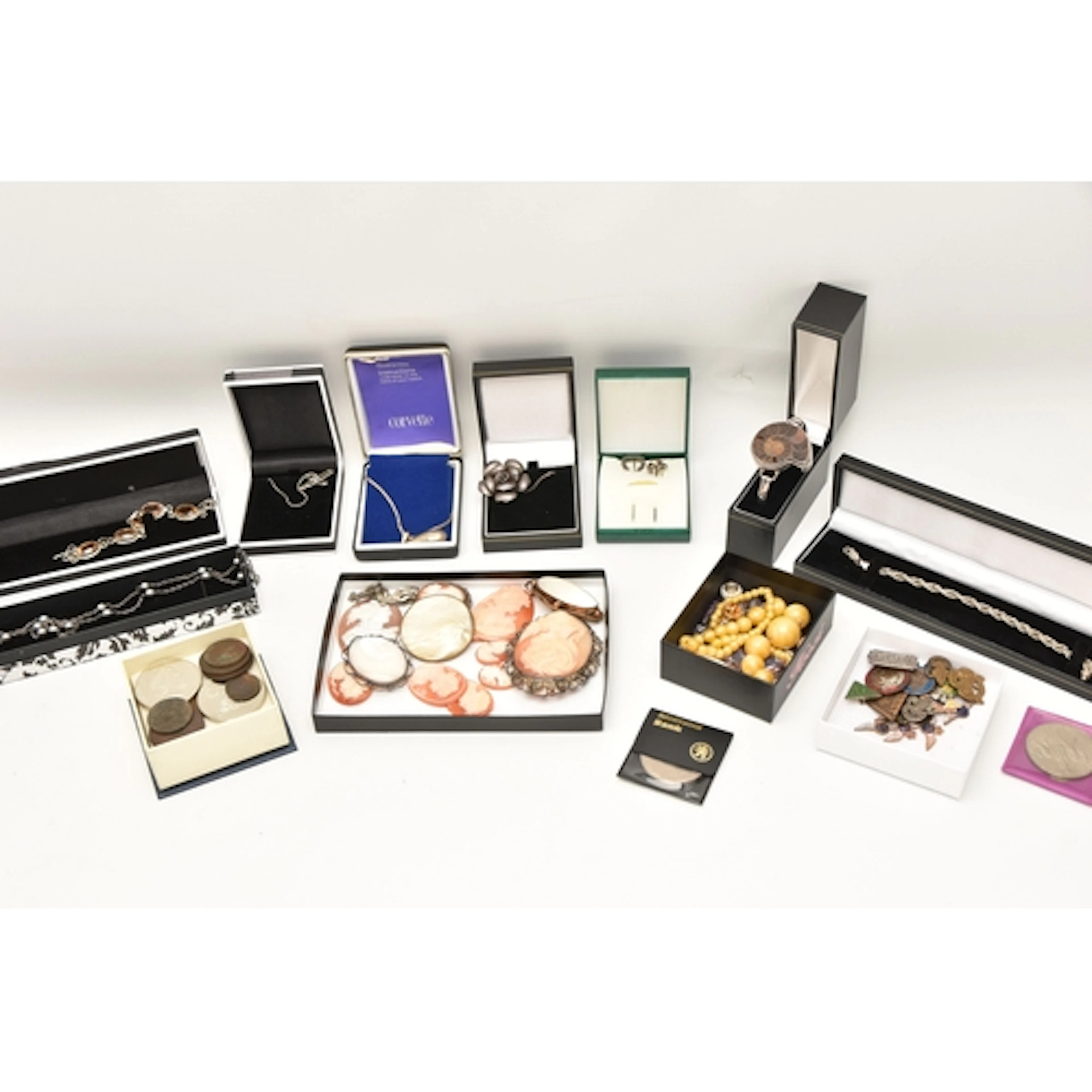 A BOX OF ASSORTED ITEMS, to include various white metal pend...