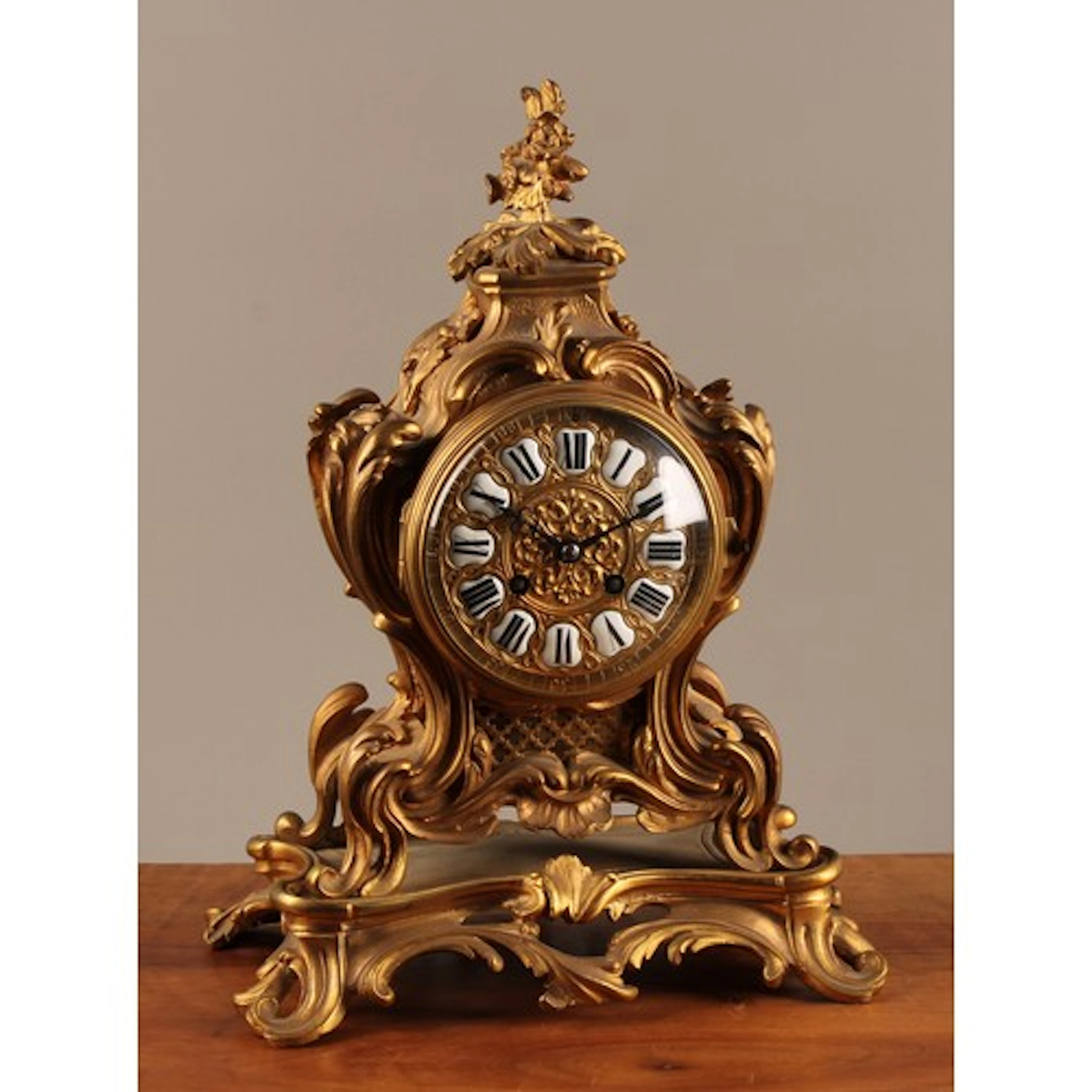 A 19th century French ormolu Rococo cartouche shaped mantel ...