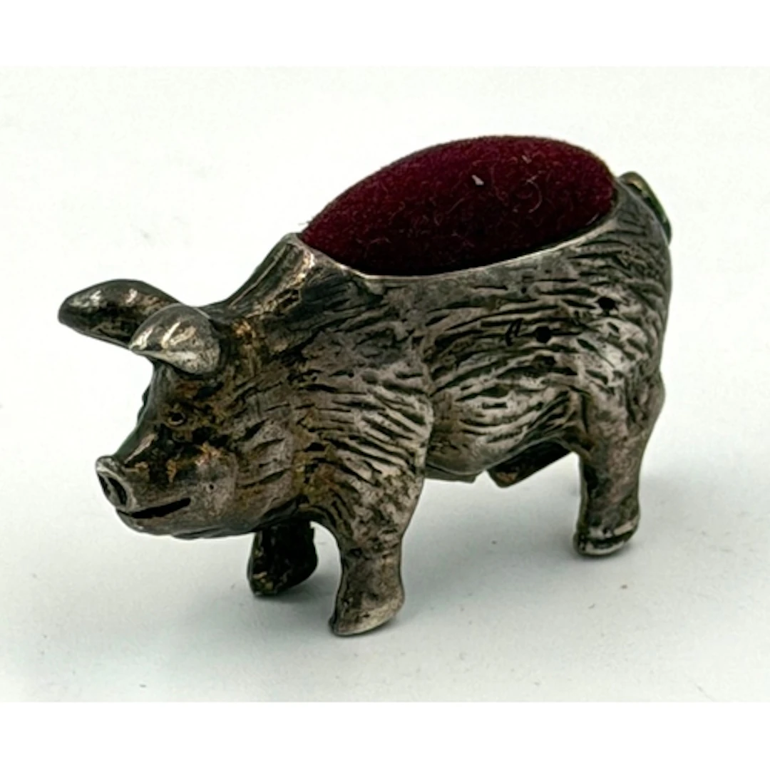 A silver, marked 925, pig pin cushion, length 4cm