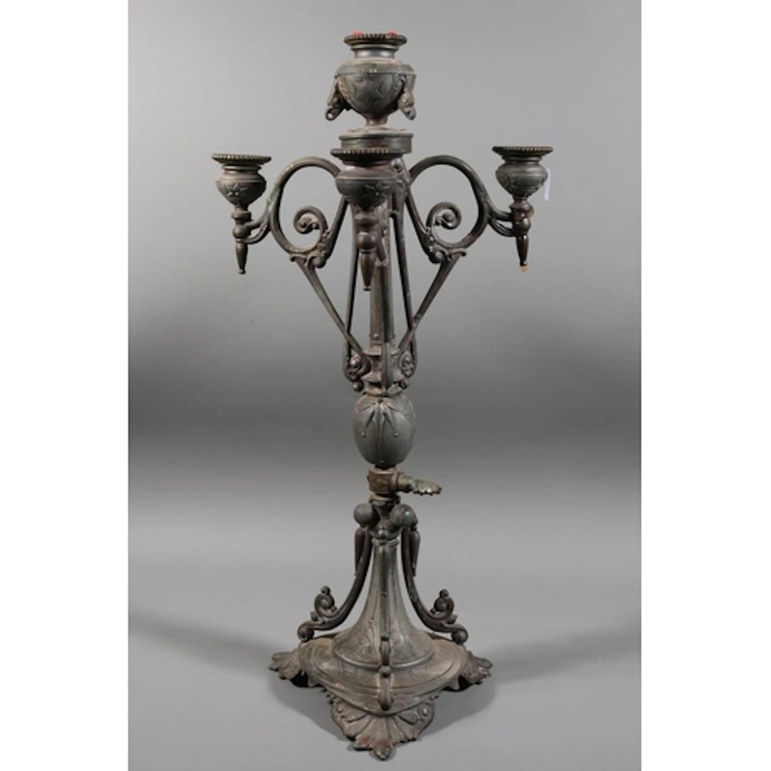Table candelabra with central urn over three scrolling brack...