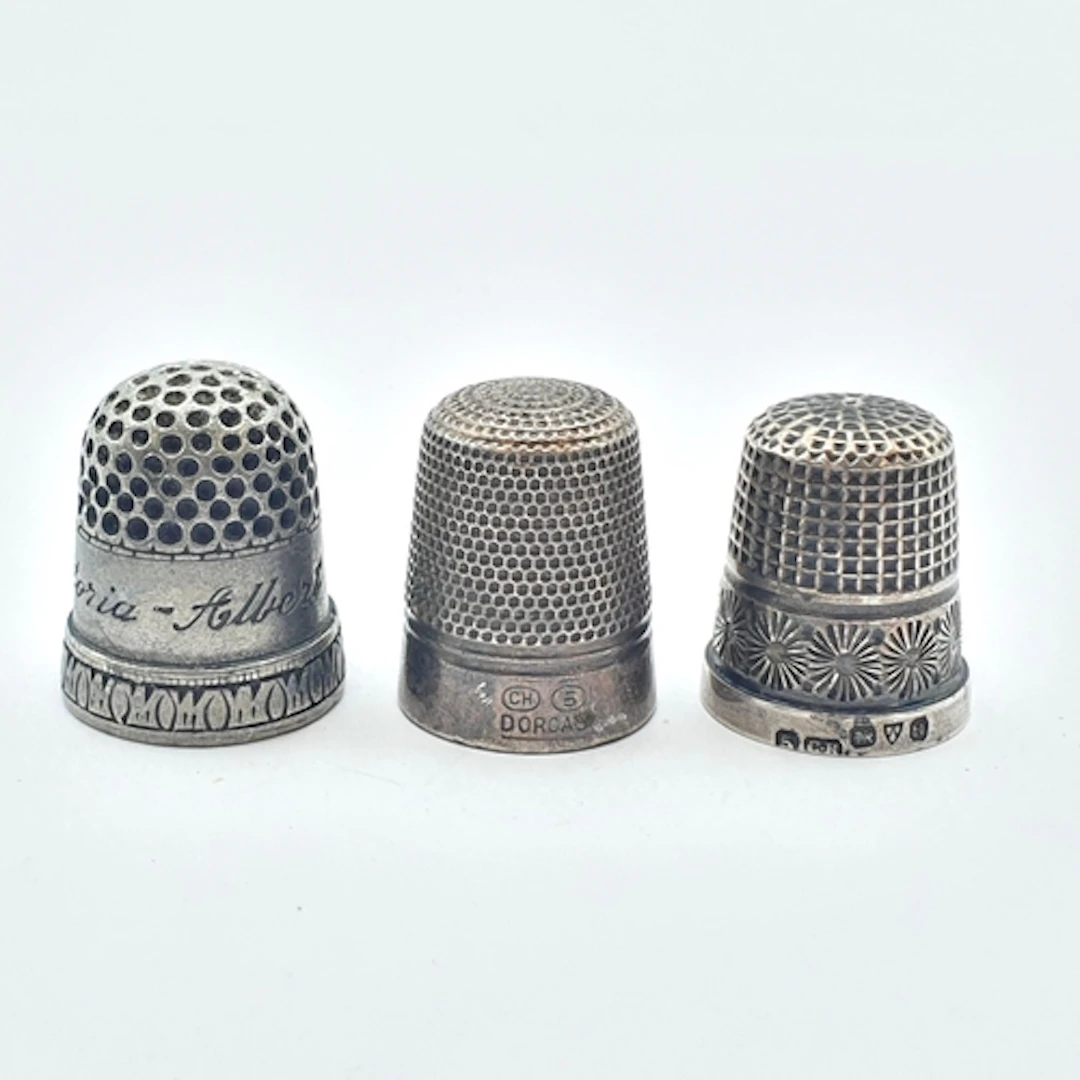 Two Charles Horner Thimbles one of them silver and a metal T...