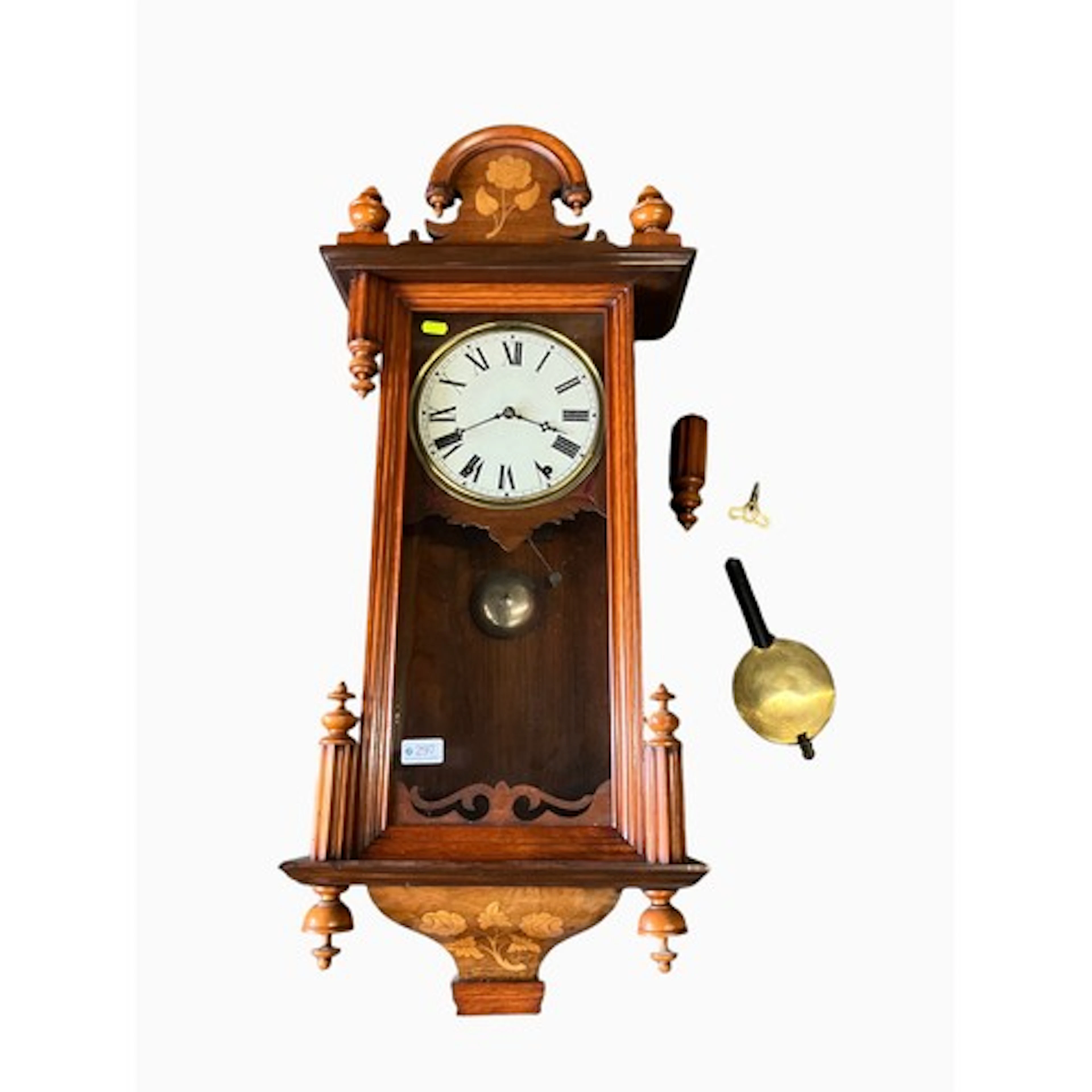 Inlaid wall hanging clock with finials