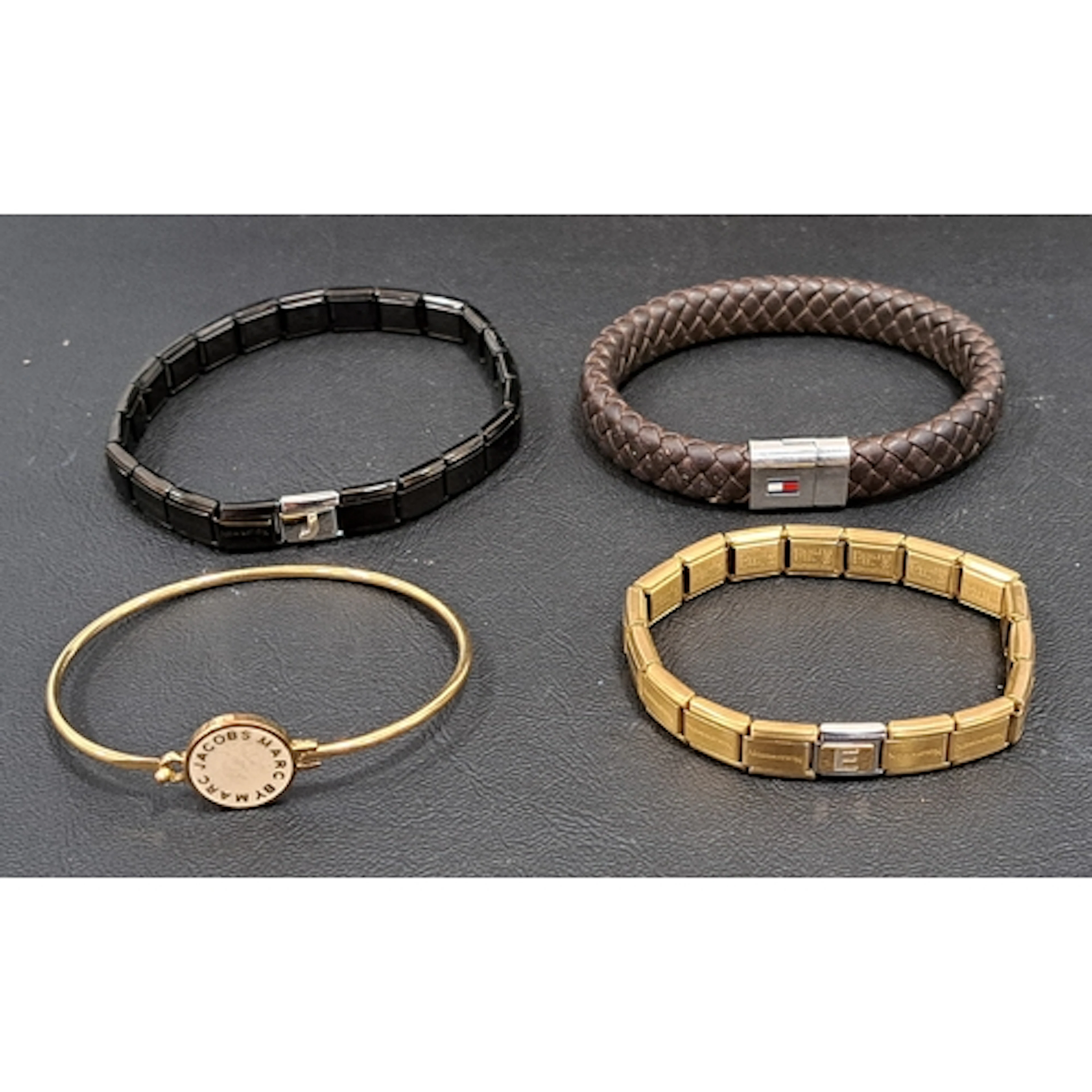 FOUR FASHION JEWELLERY BRACELETS comprising two Nomination c...