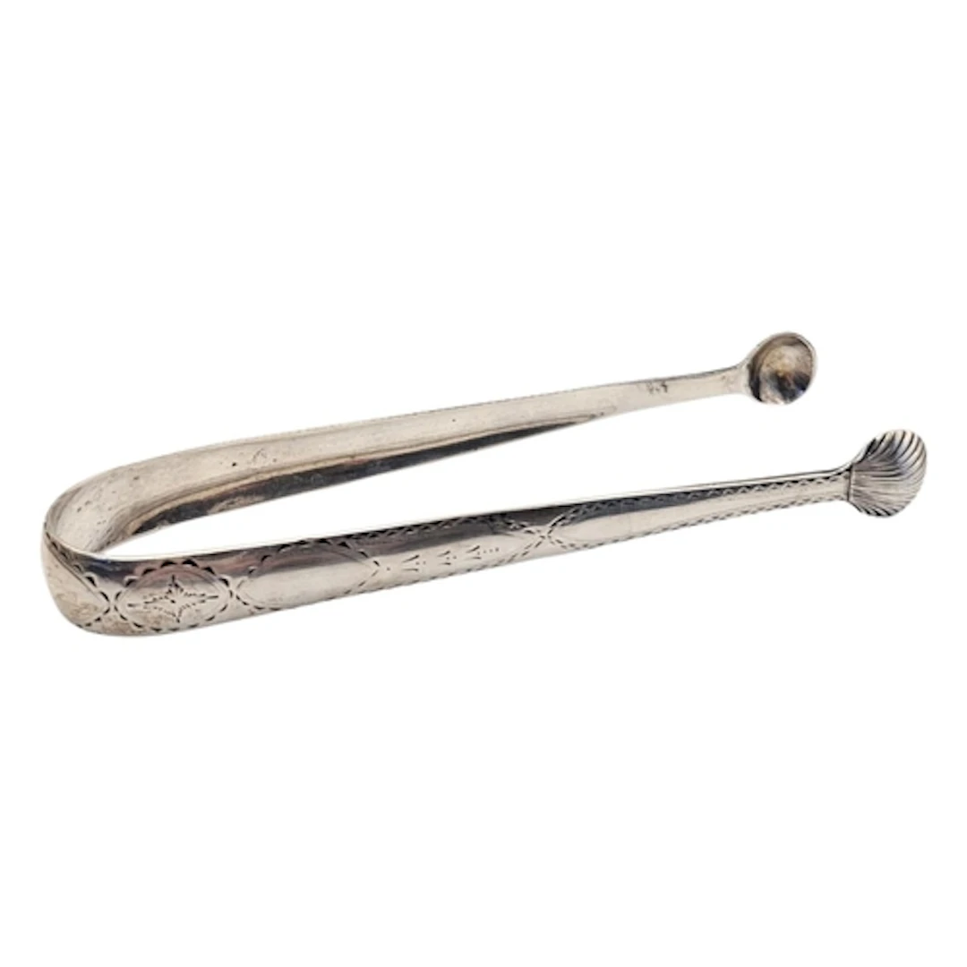 A PAIR OF GEORGIAN IRISH SILVER SUGAR TONGS Five classical ...
