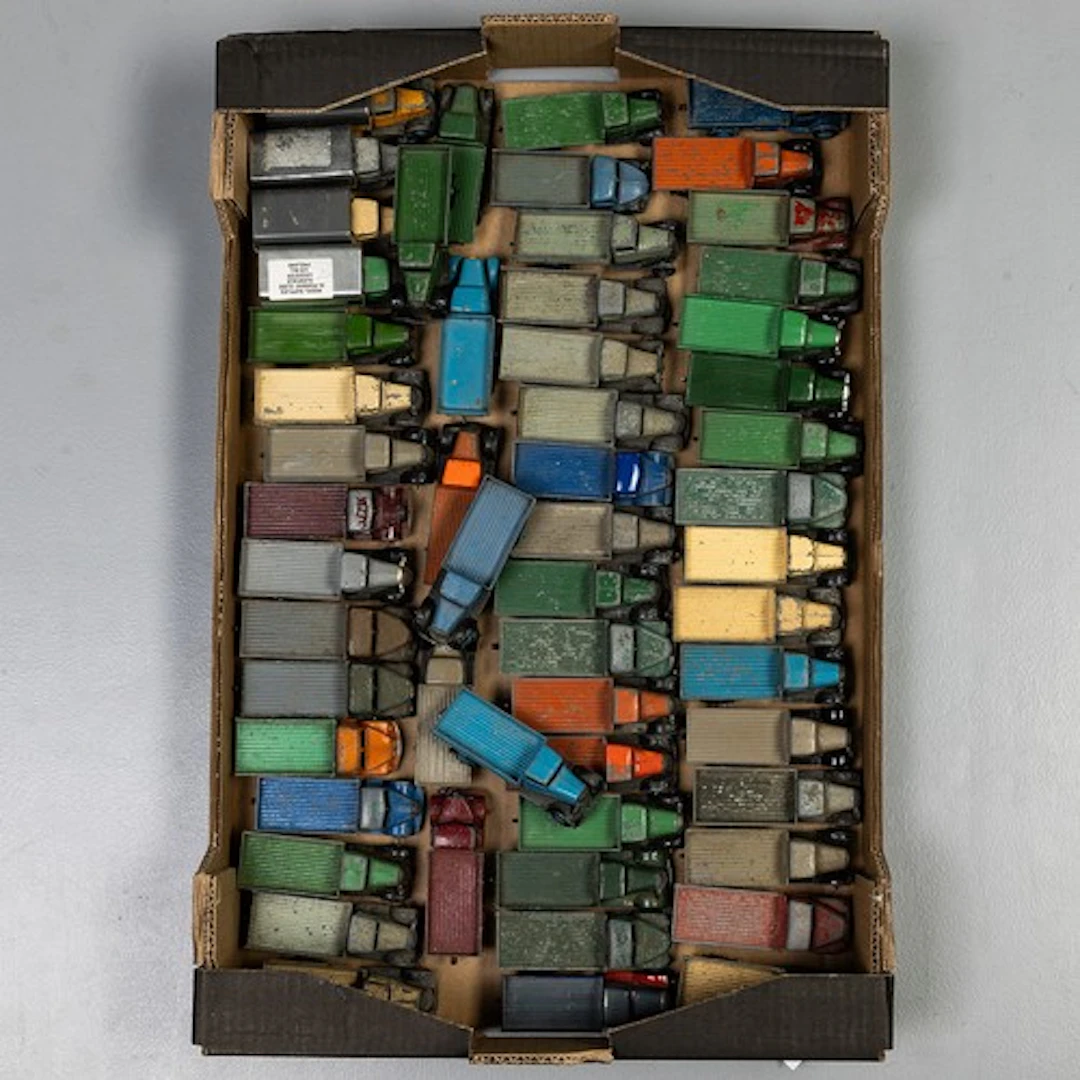 Fruit tray containing 56 unboxed early Dinky commercial vehi...