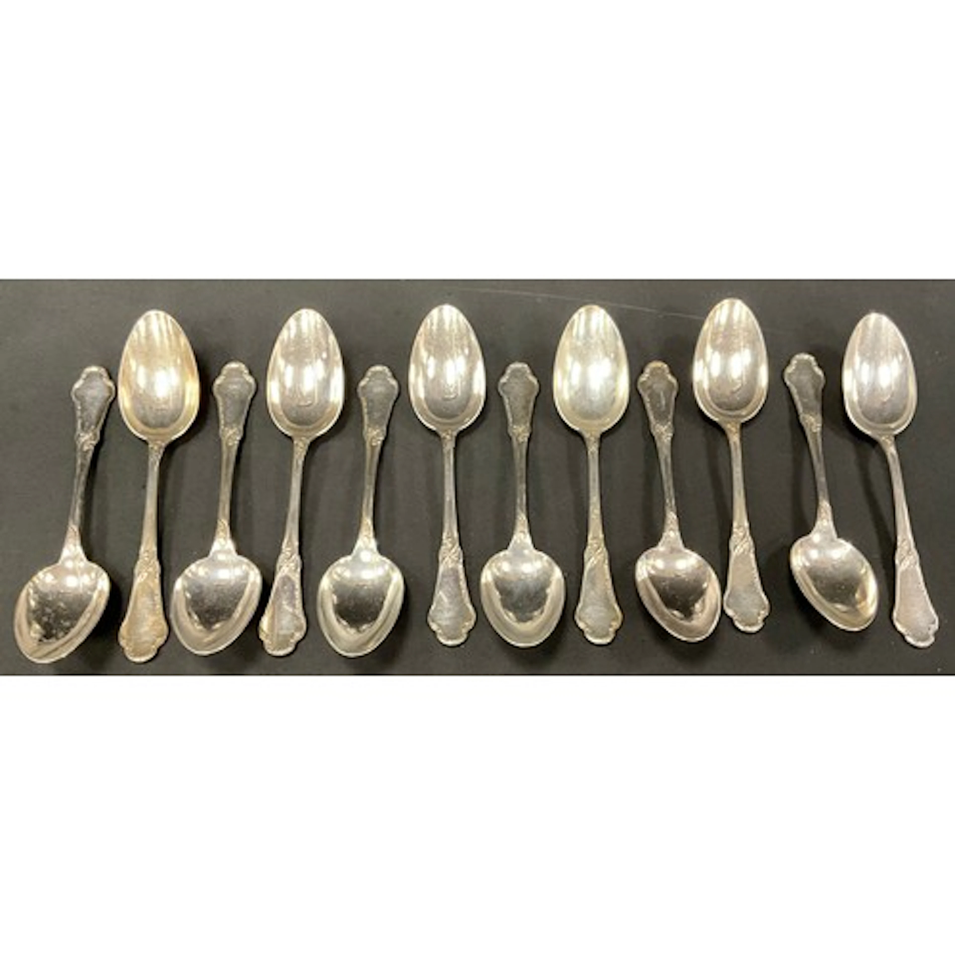A set of twelve late 19th century French 950 standard silver...
